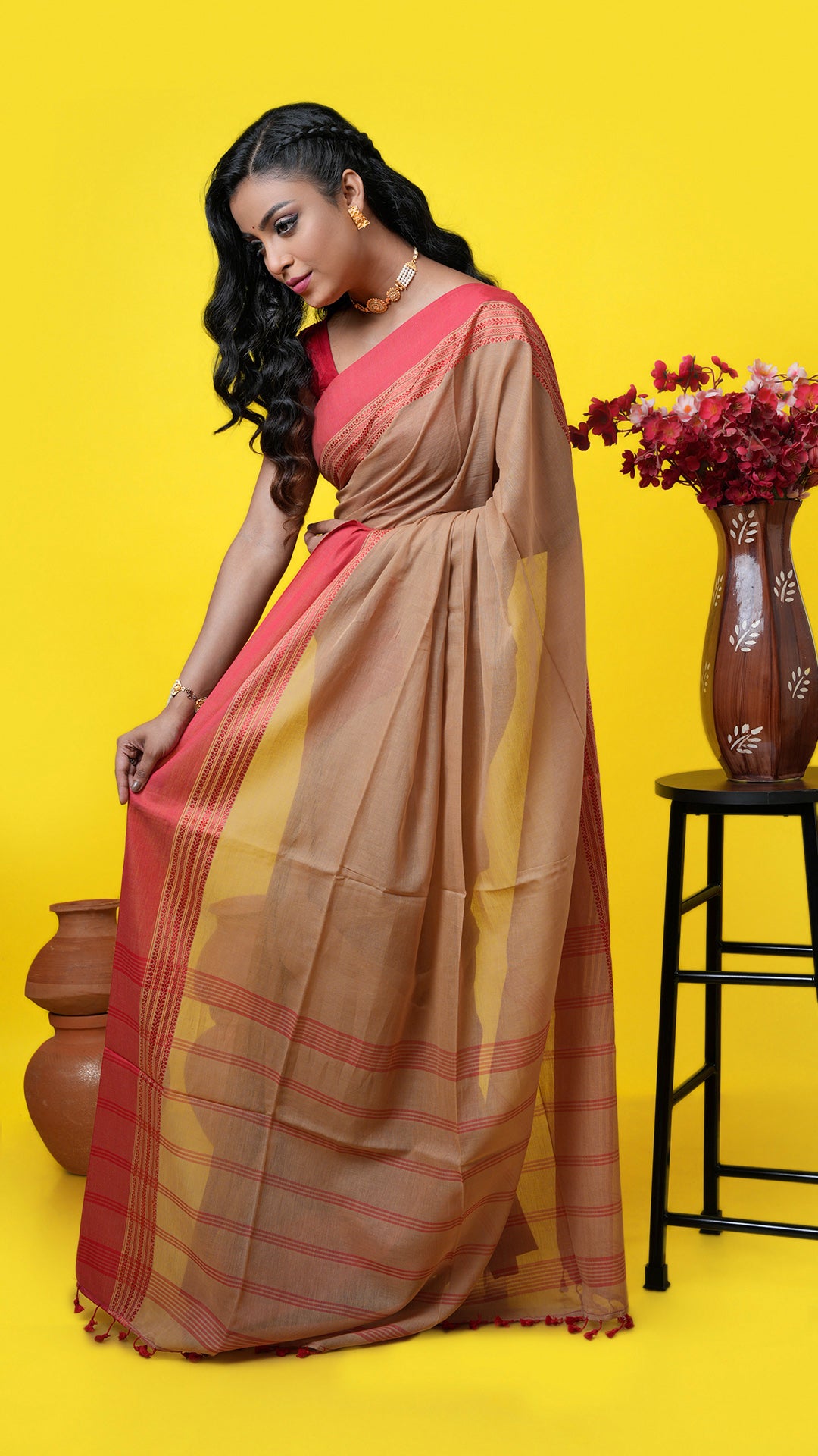 Dark beige soft cotton Tangail saree with red woven border and striped pallu, no butis. Price: Rs. 900/-