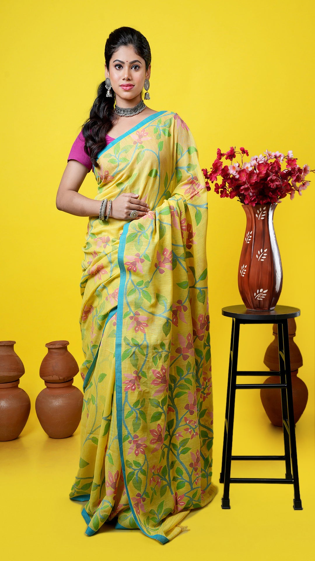 Yellow soft cotton Dhakai saree with multicolor floral design in blue, magenta, green, and pink. Price: Rs. 48500/-
