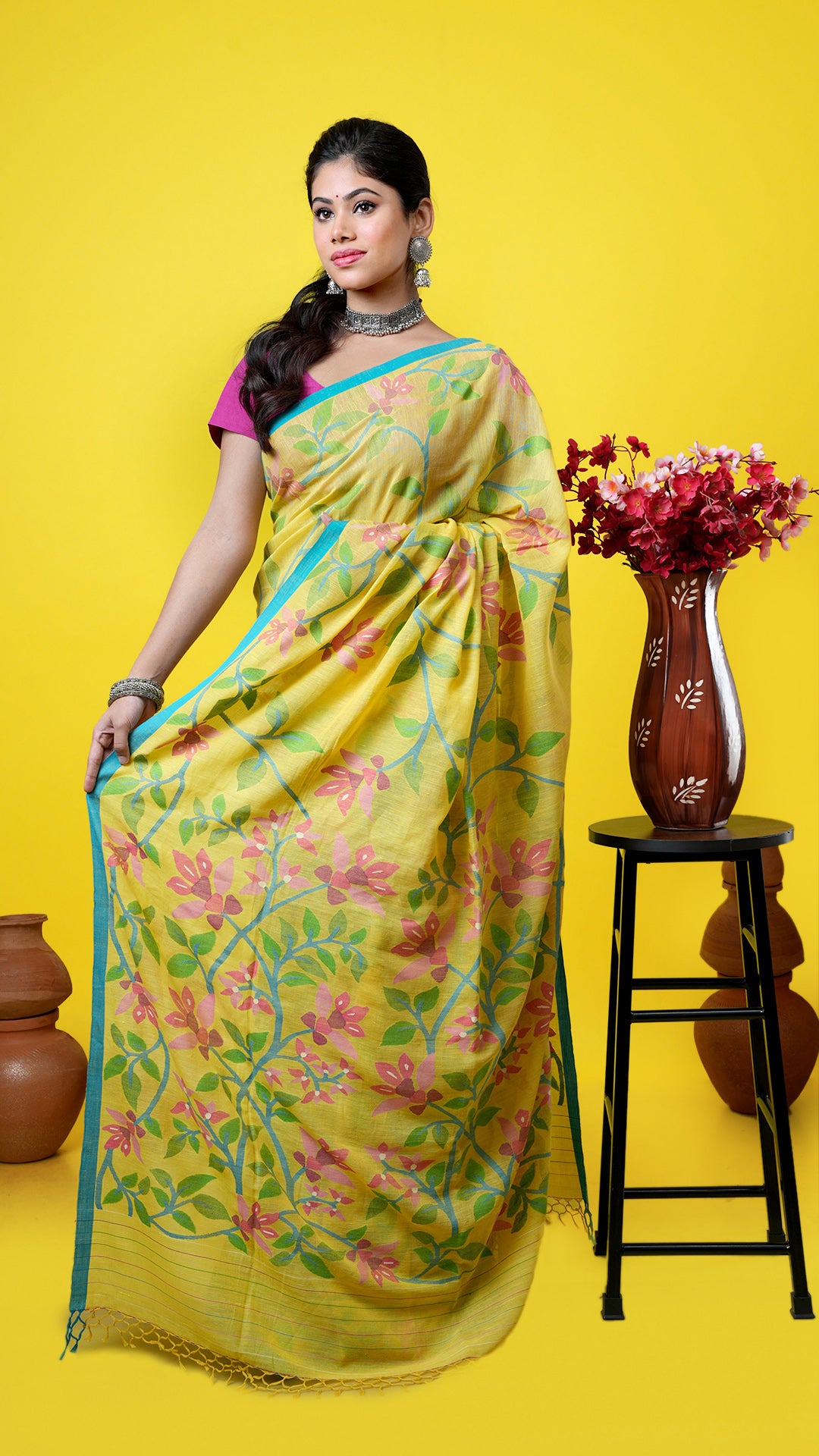 A yellow dhakai saree