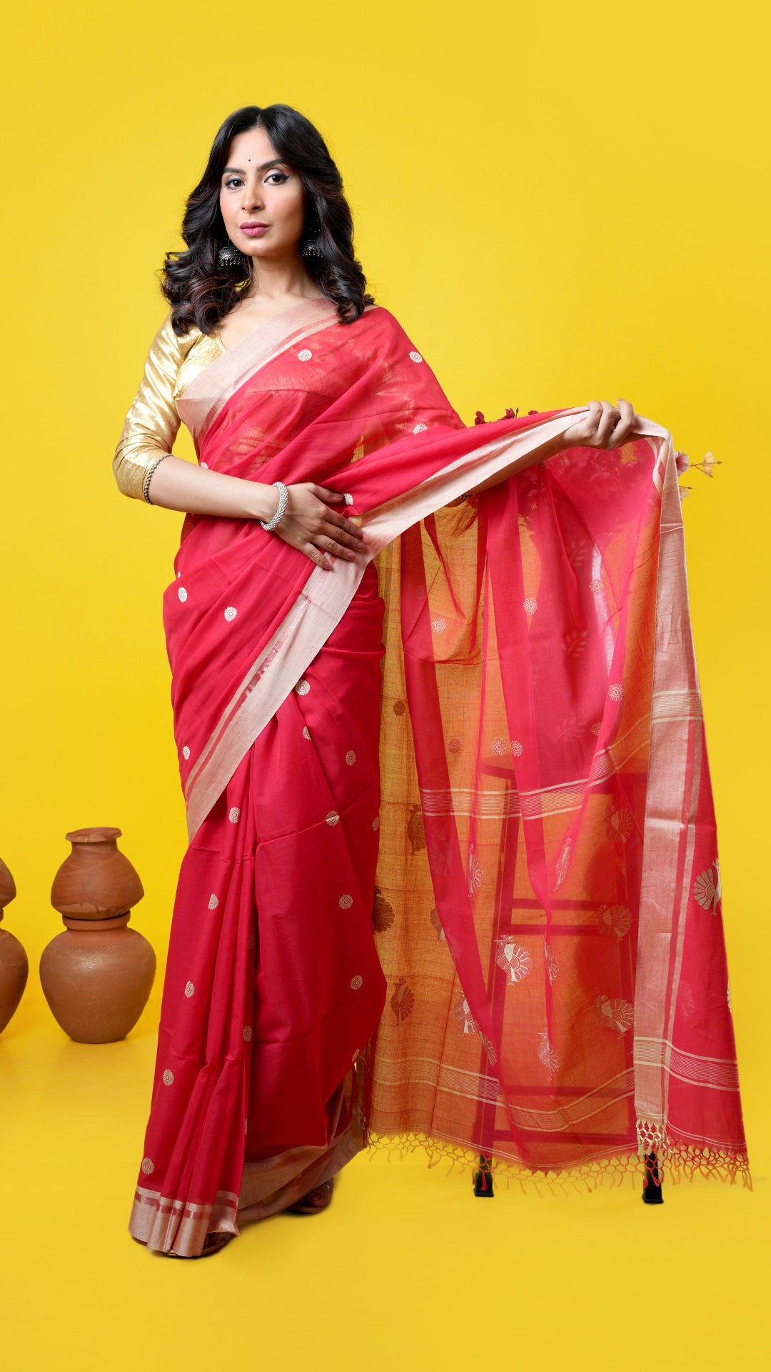 Red soft cotton Tangail saree with beige and golden zari border, beige butis, and bird motif pallu. Price: Rs. 2600/-