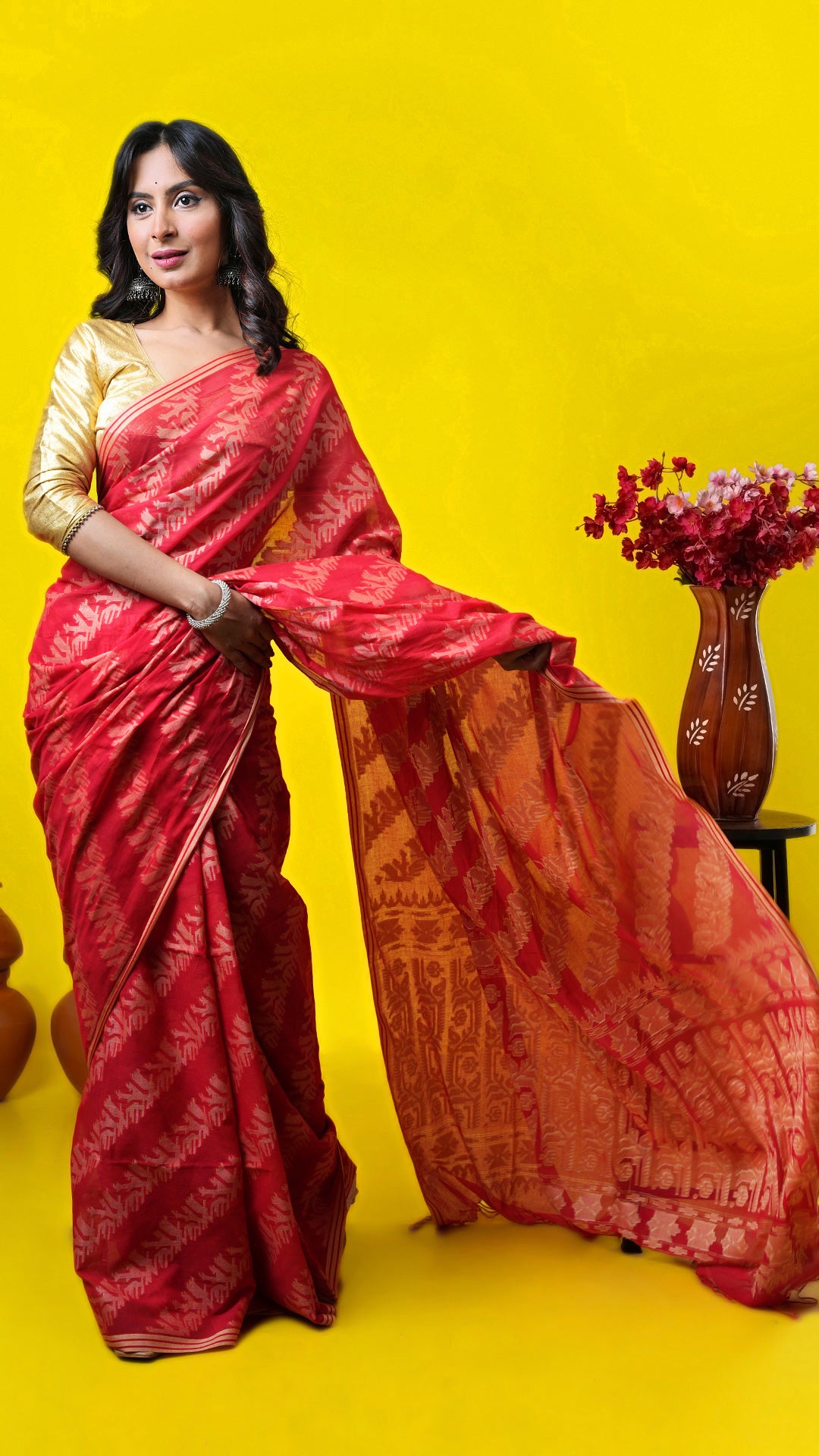 Red soft cotton machine-made saree with beige weave all over and pallu. Price: Rs. 2600/-