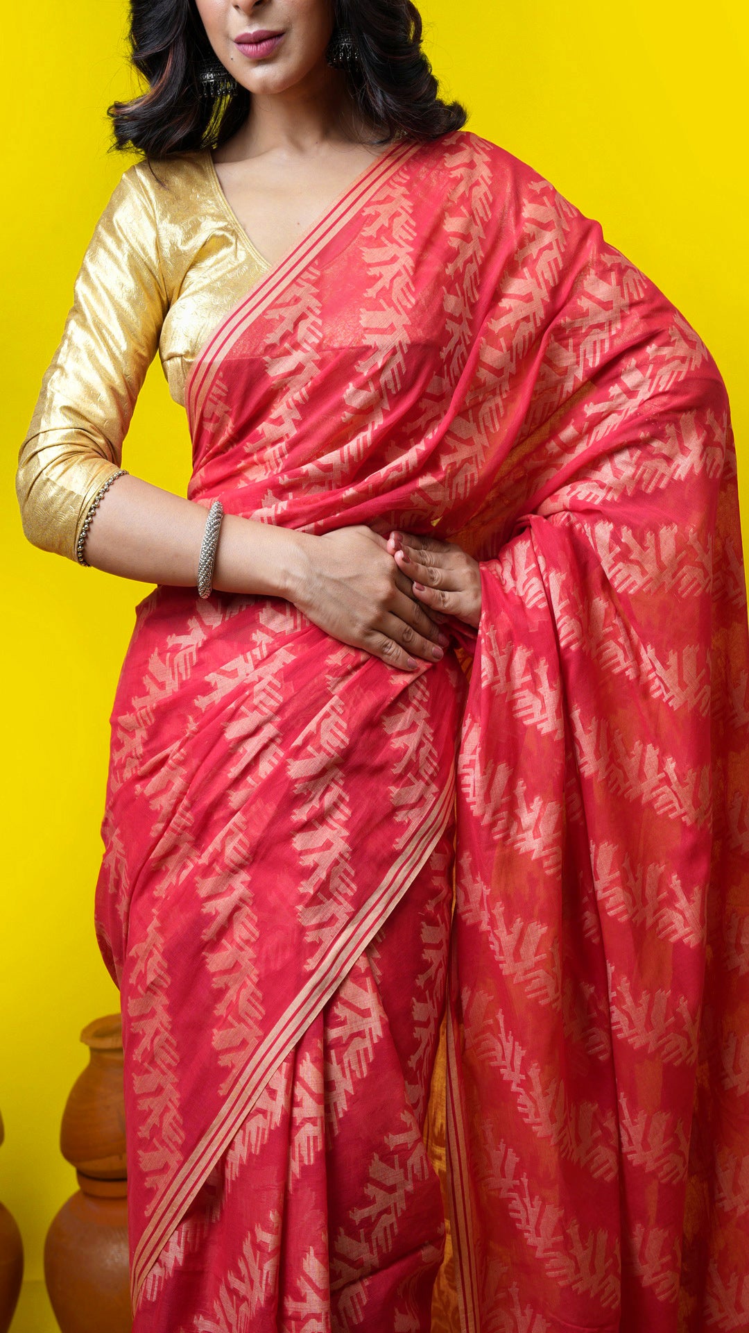 A red all over woven saree