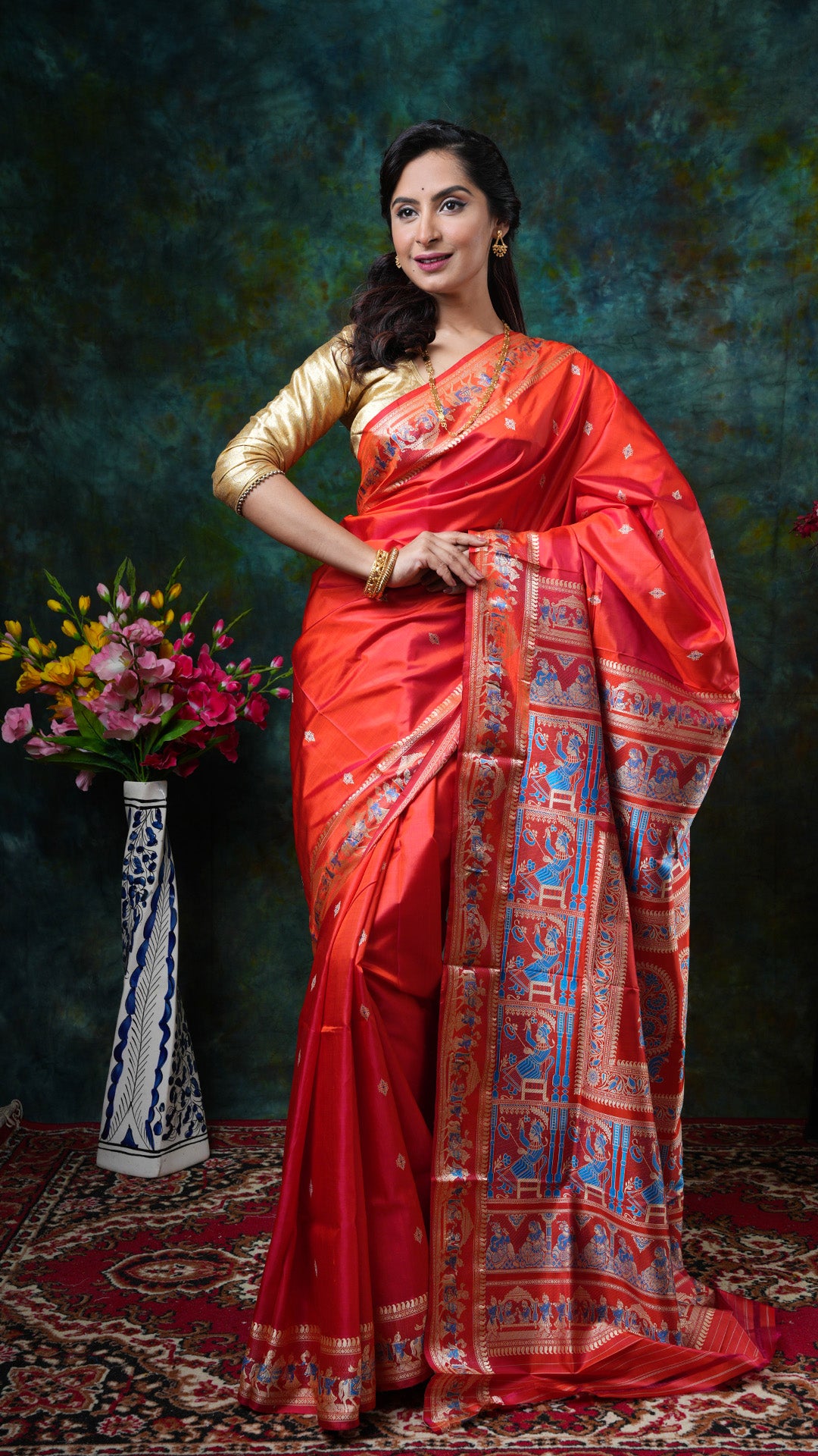 Flame-coloured silk Baluchari saree with beige and blue woven motifs and single box pallu. Price: Rs. 24000/-