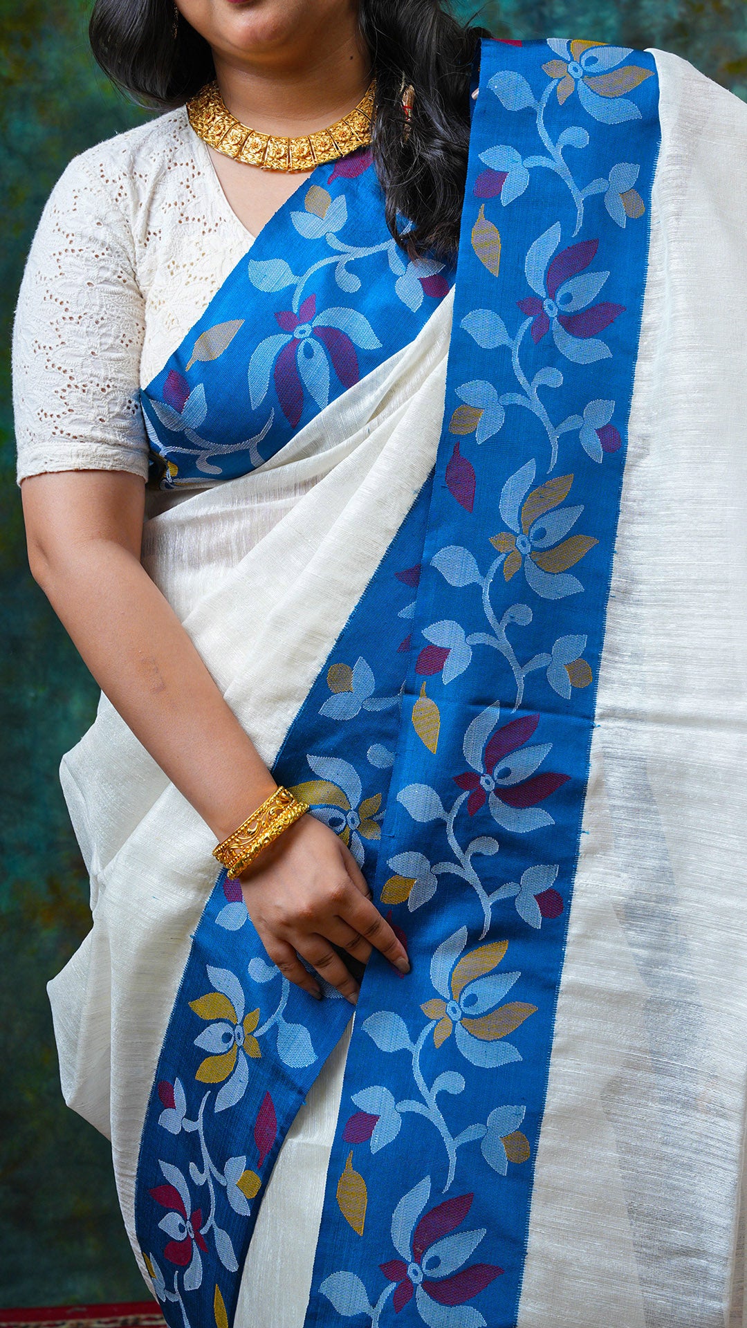 An off white raw silk saree