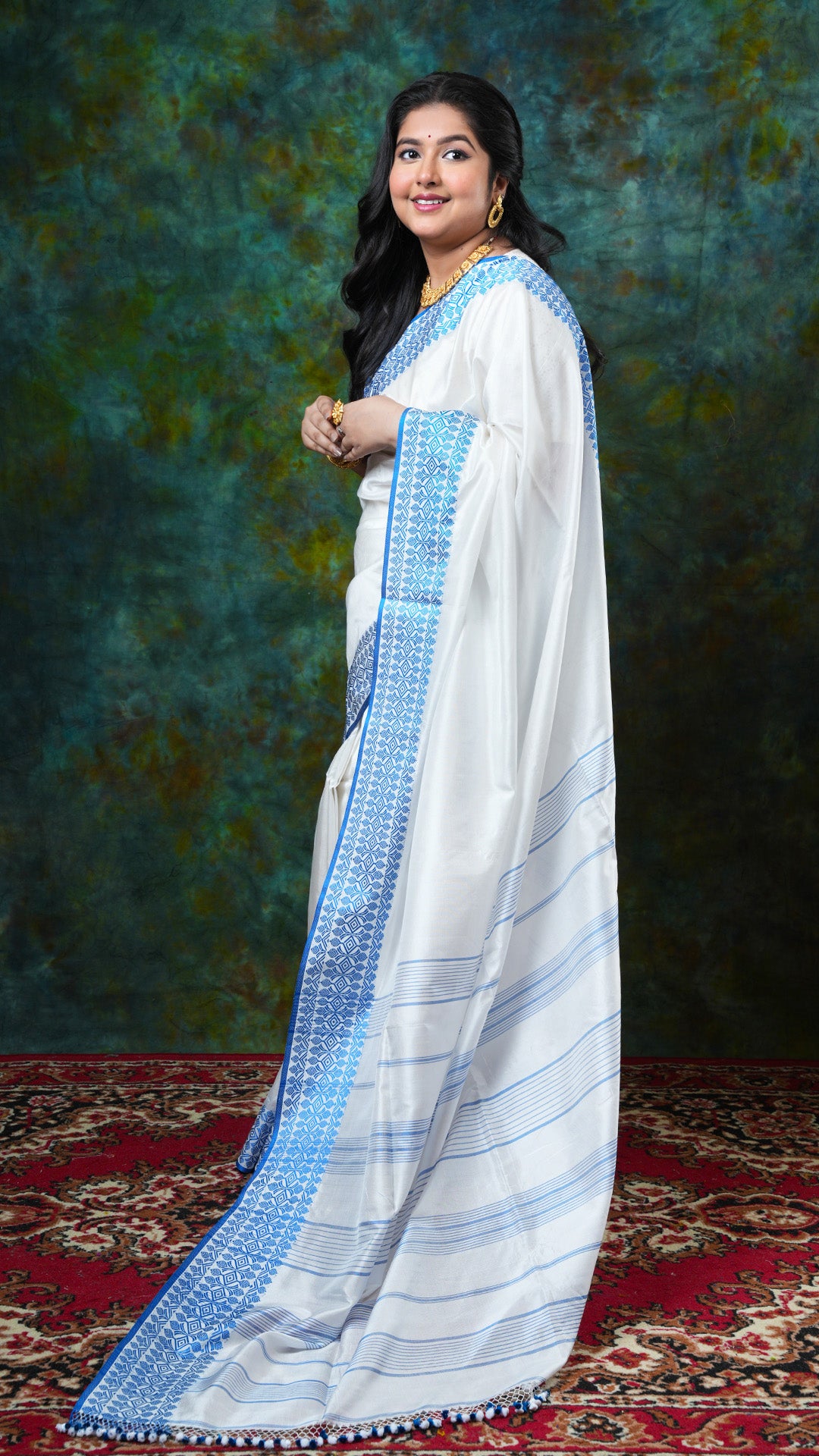 A white and blue silk saree