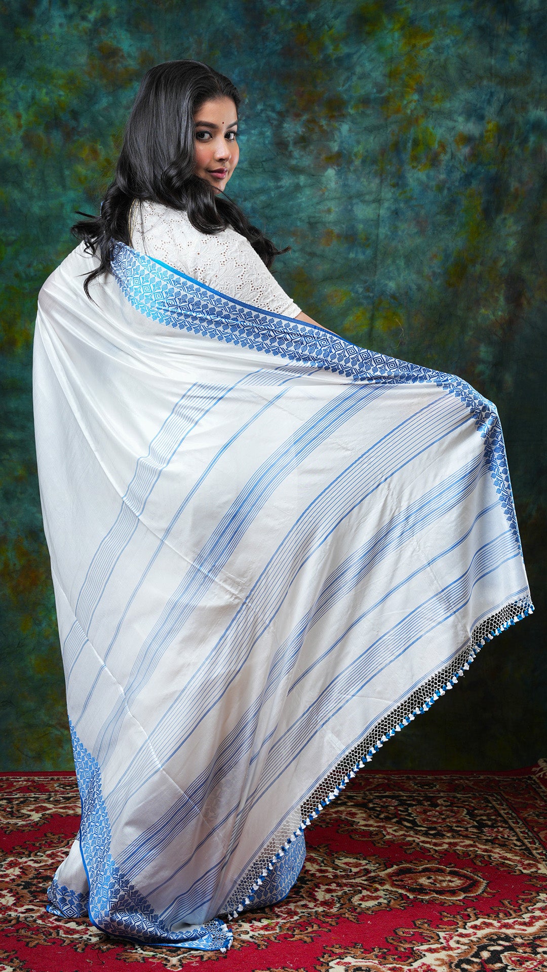 A white and blue silk saree