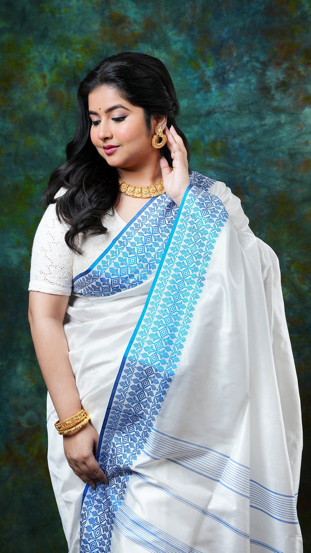 A white and blue silk saree