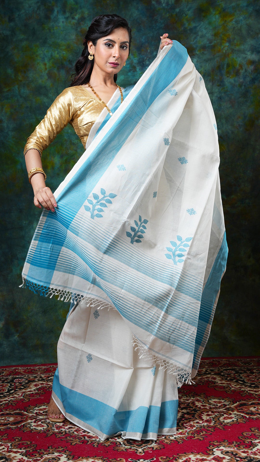 A off white and blue tissue saree