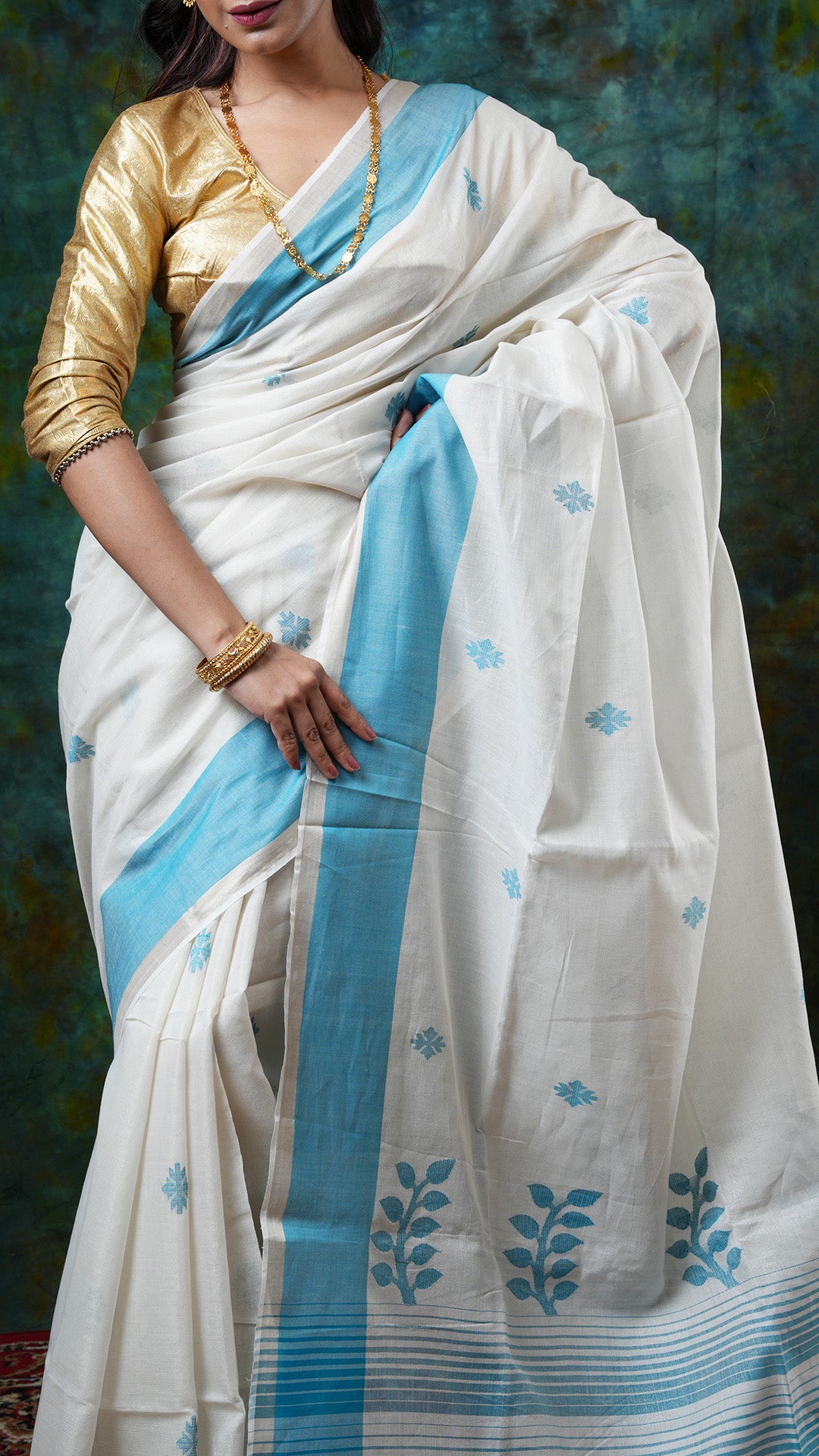 A off white and blue tissue saree