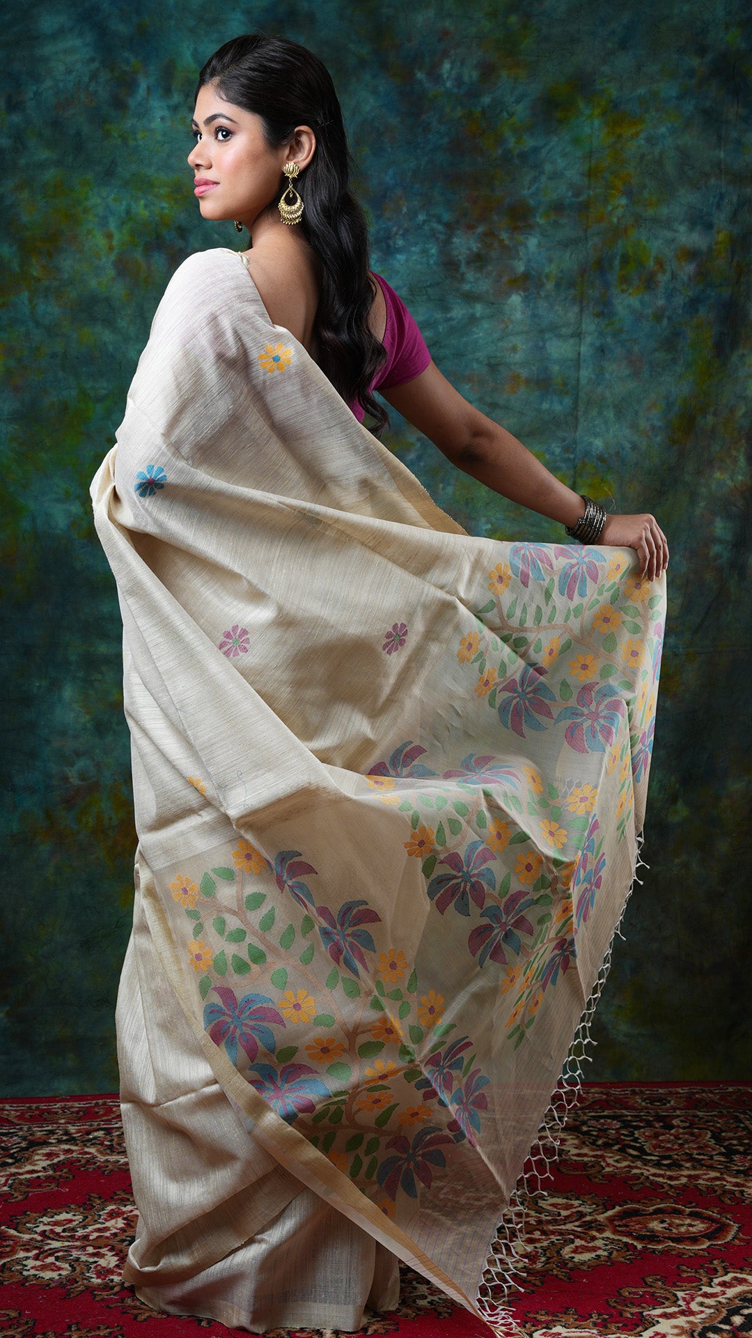 A dark off white raw silk saree