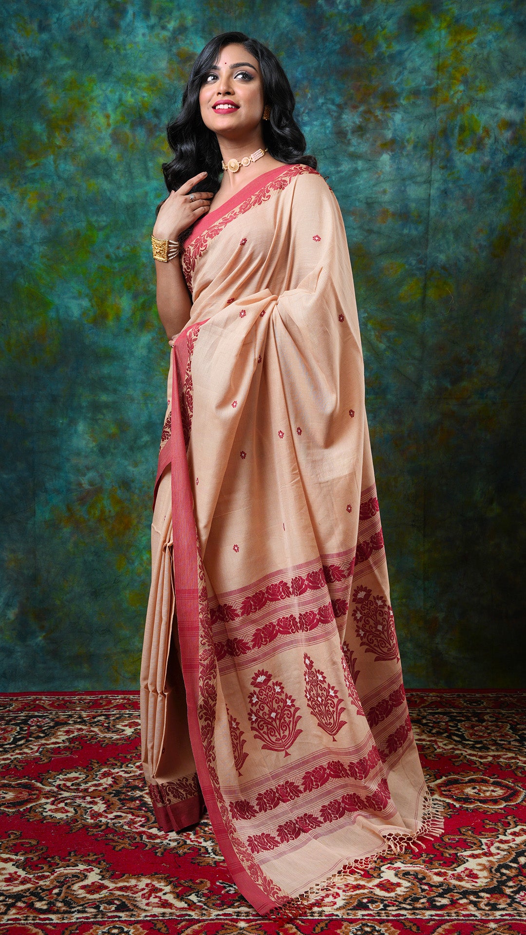 Beige soft cotton Tangail saree with maroon and off-white woven border, butis, and pallu. Price: Rs. 3000/-