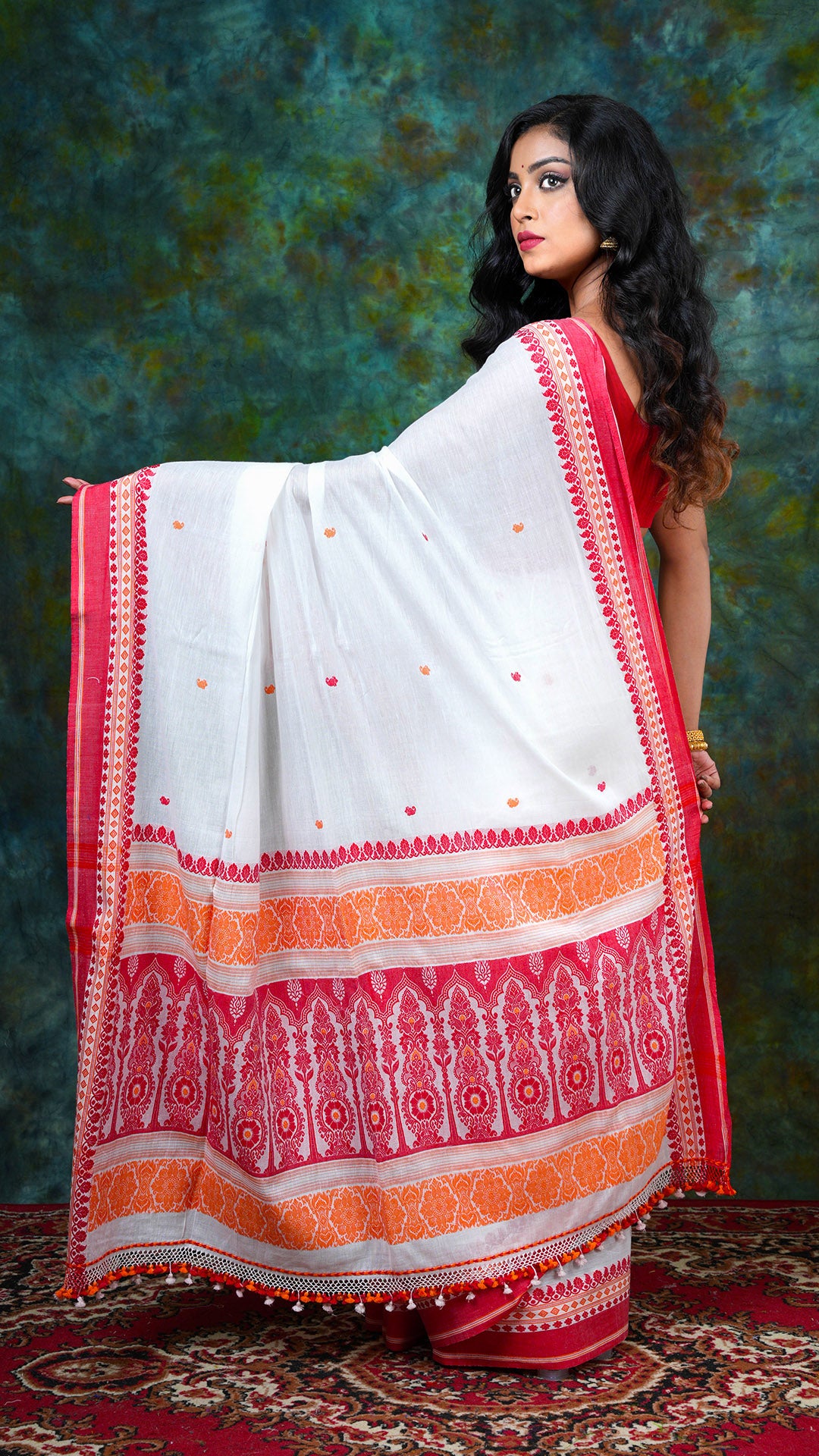 A off white with red and orange tangail saree