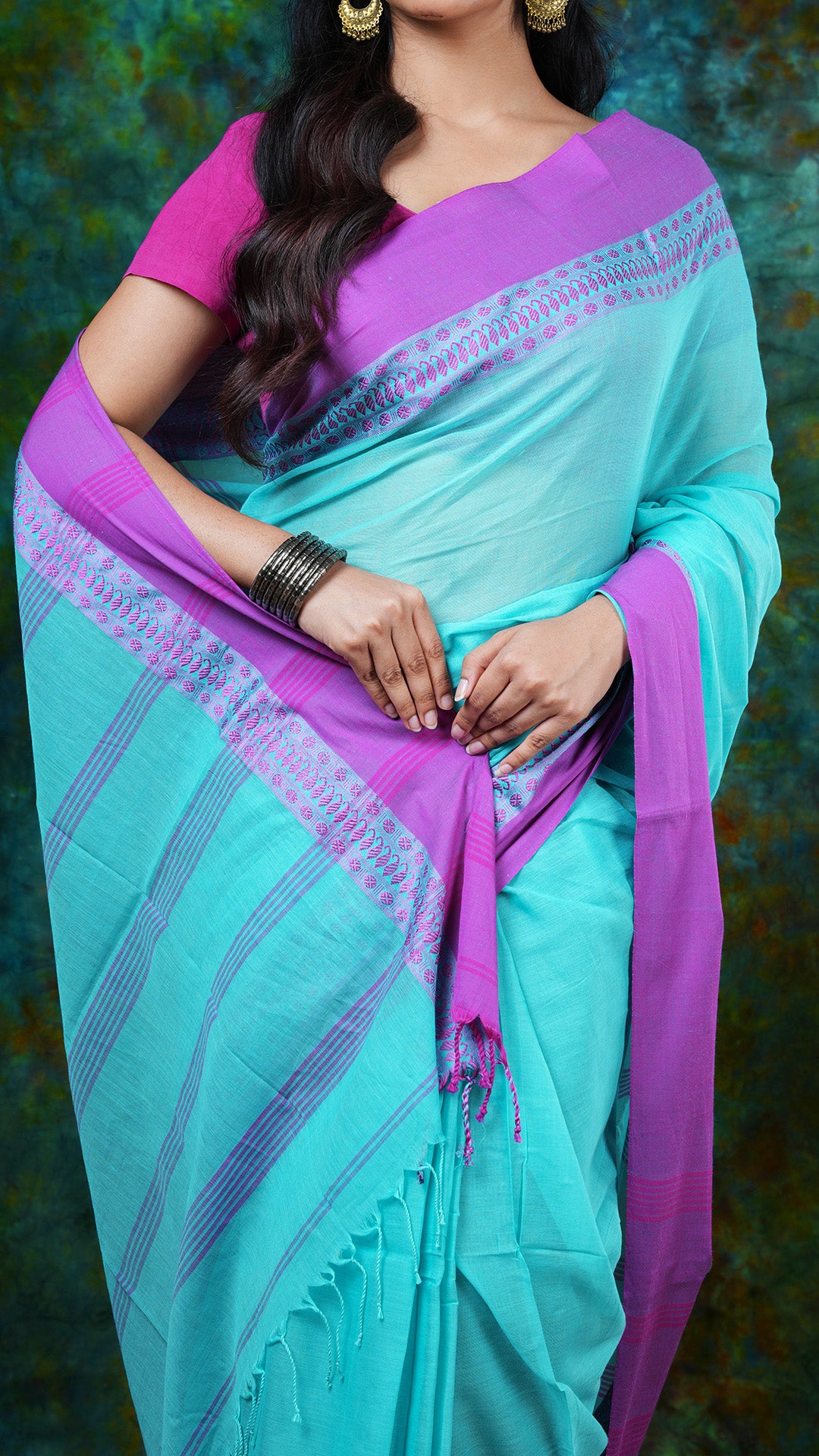 A aqua blue with magenta tangail saree