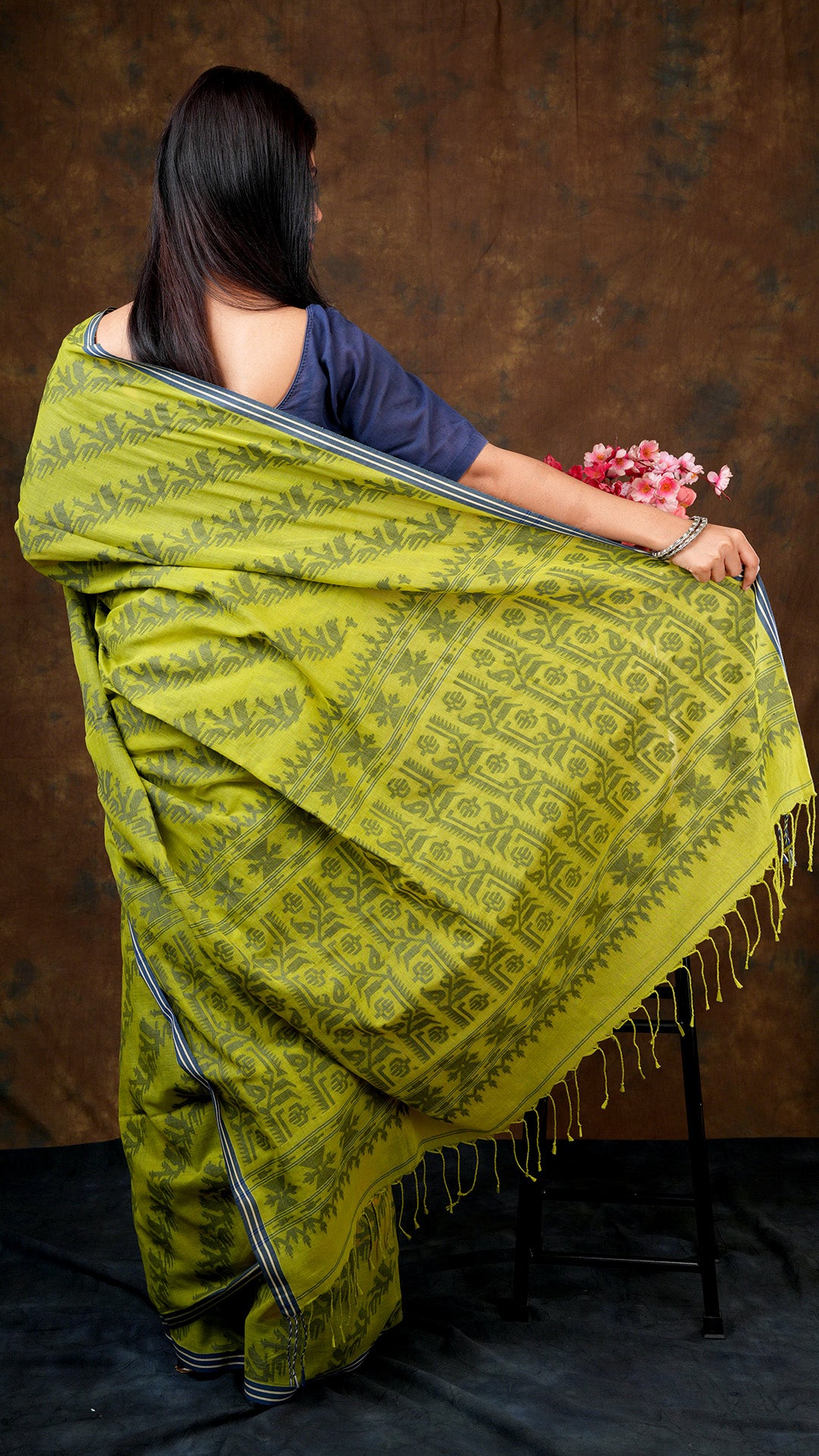 A leafy green dhakai saree