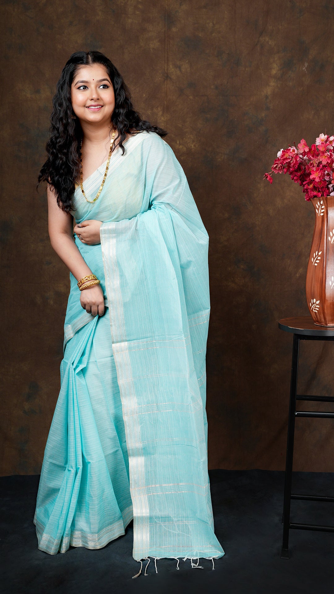 A sea green blue tangail saree - A sea green and blue tangail saree with intricate borders. This elegant Tangail saree, soft cotton saree is perfect for traditional occasions.