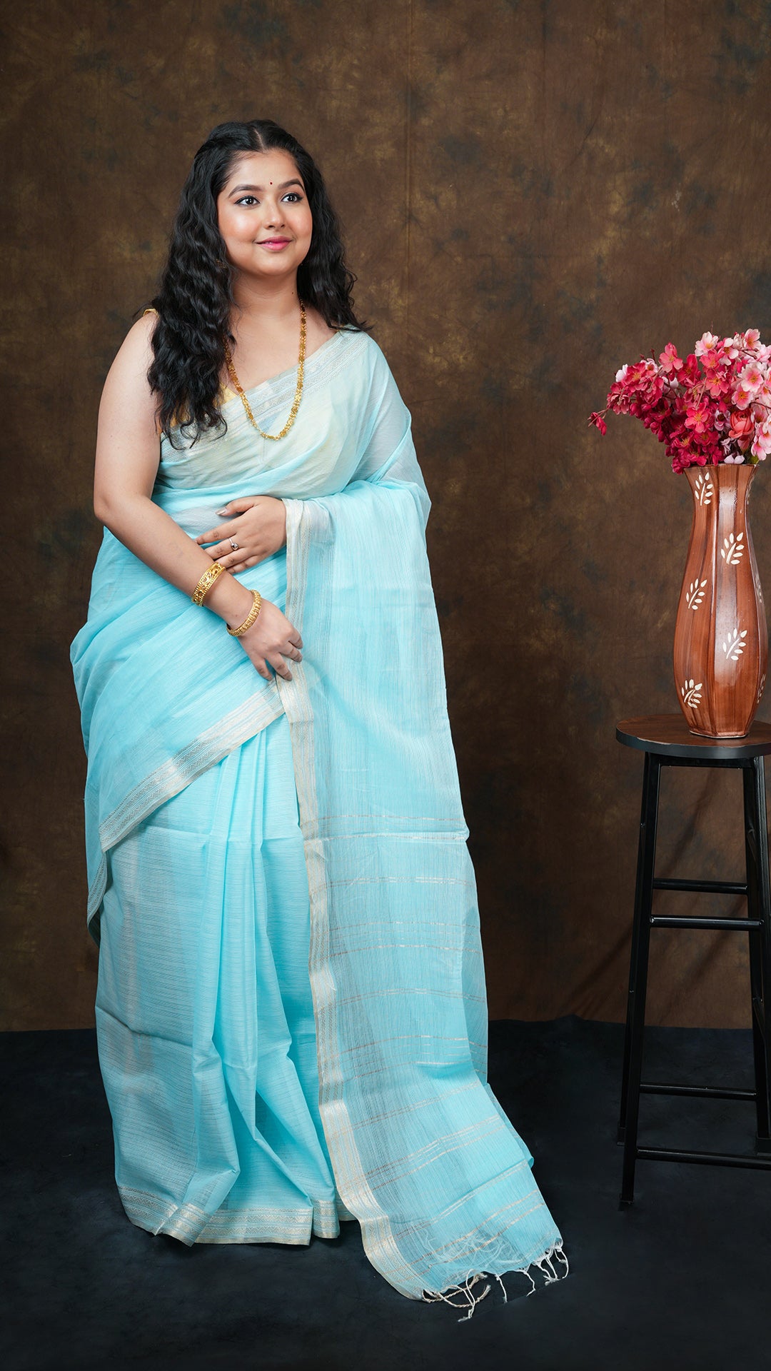 A firozi coloured tangail saree - A firozi blue saree with tangail weave and rich detailing. This elegant Tangail saree, soft cotton saree is perfect for traditional occasions.