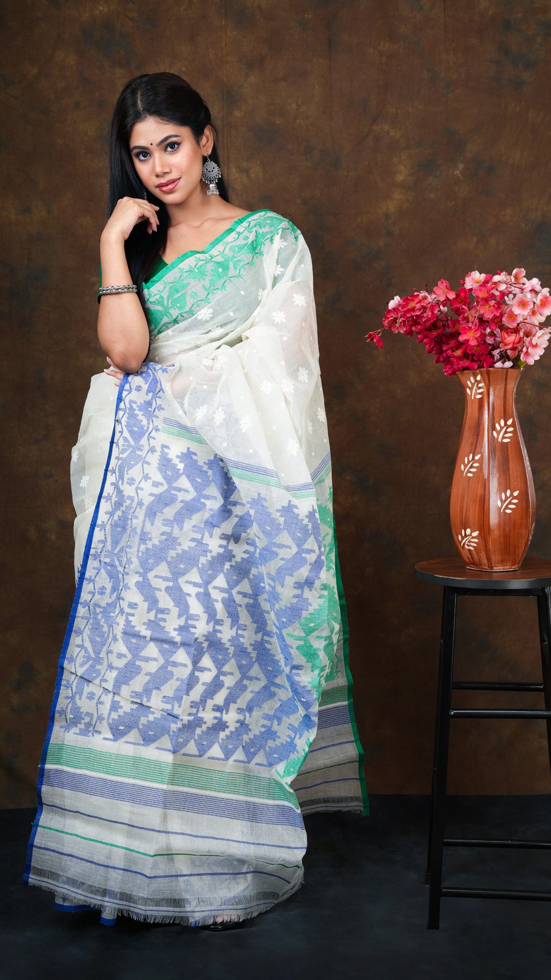 An off white jamdani saree