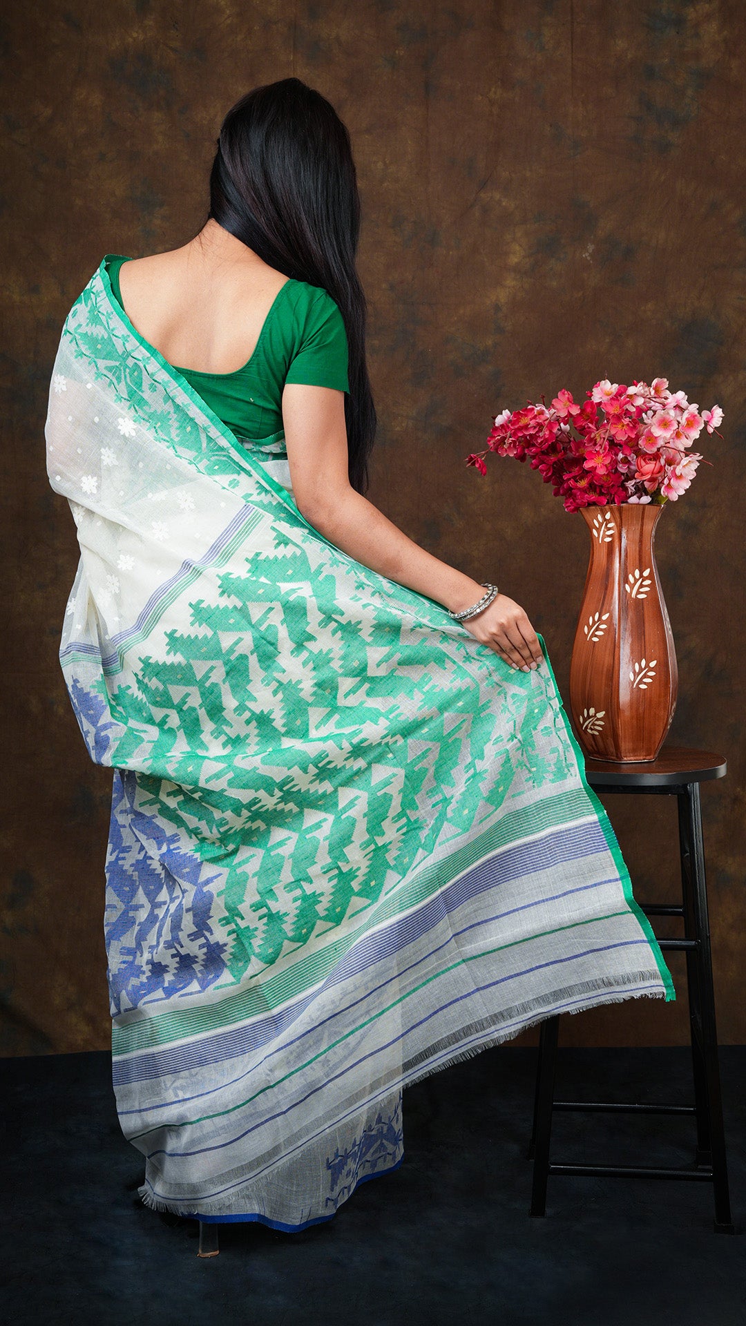An off white jamdani saree