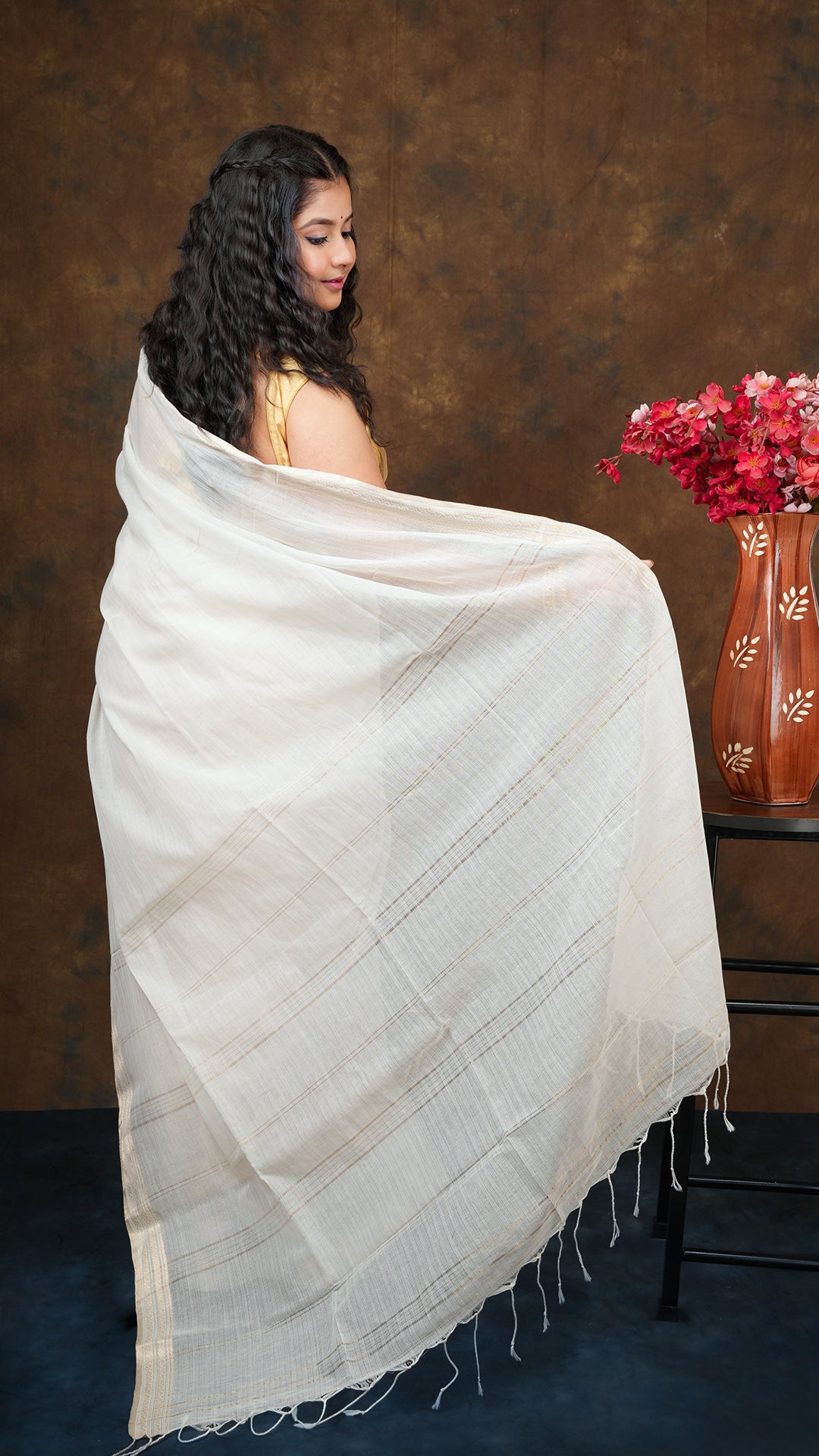 An off white tangail saree