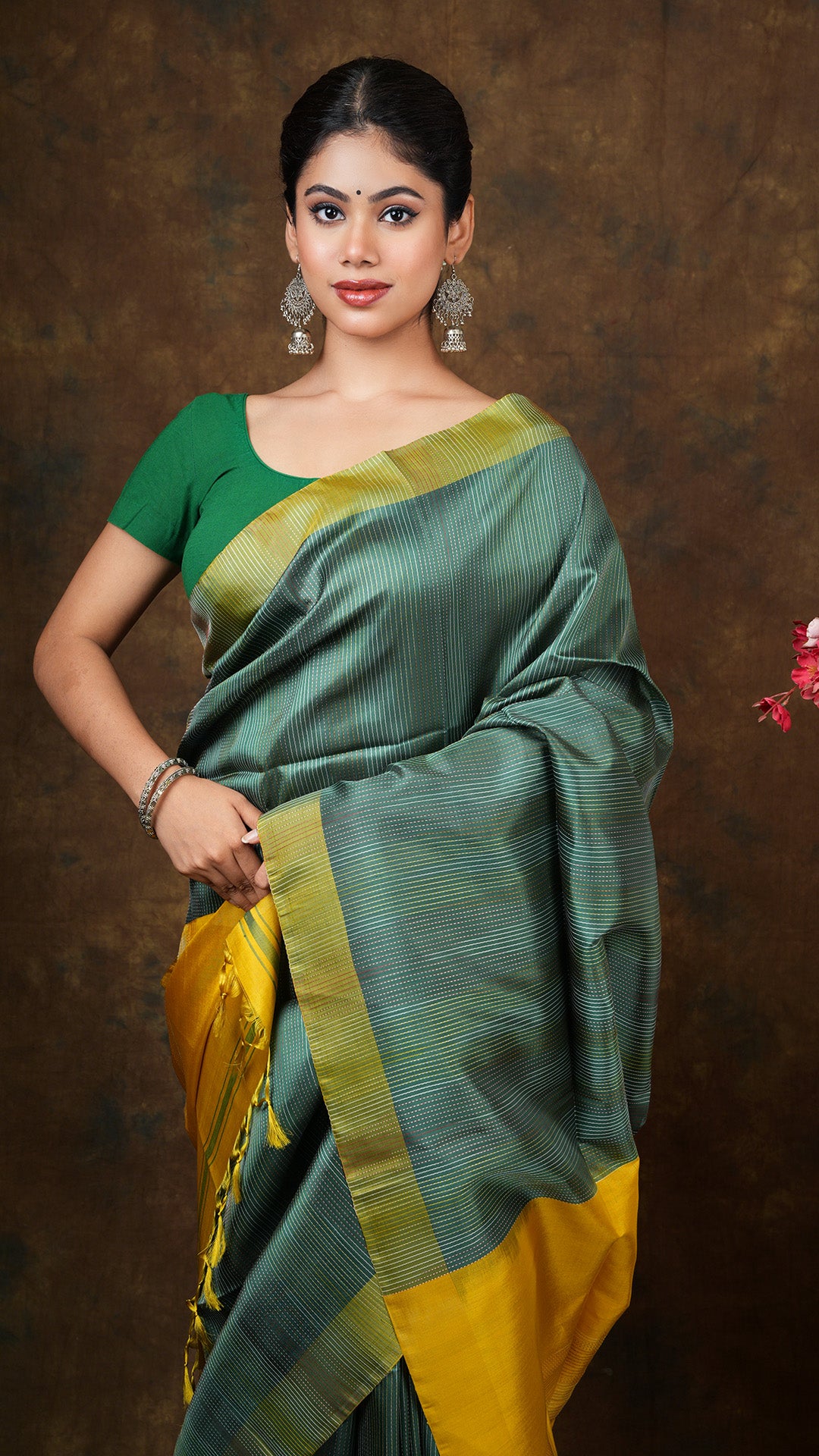 A dark green silk saree