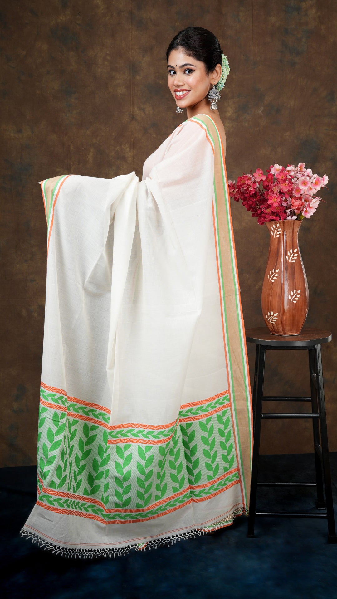 An off white tangail saree