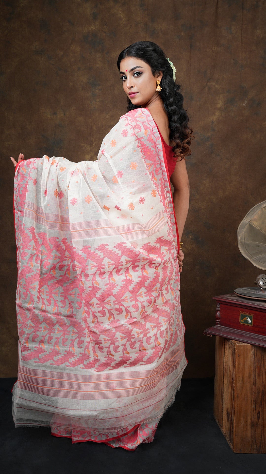 An off white with red and orange jamdani