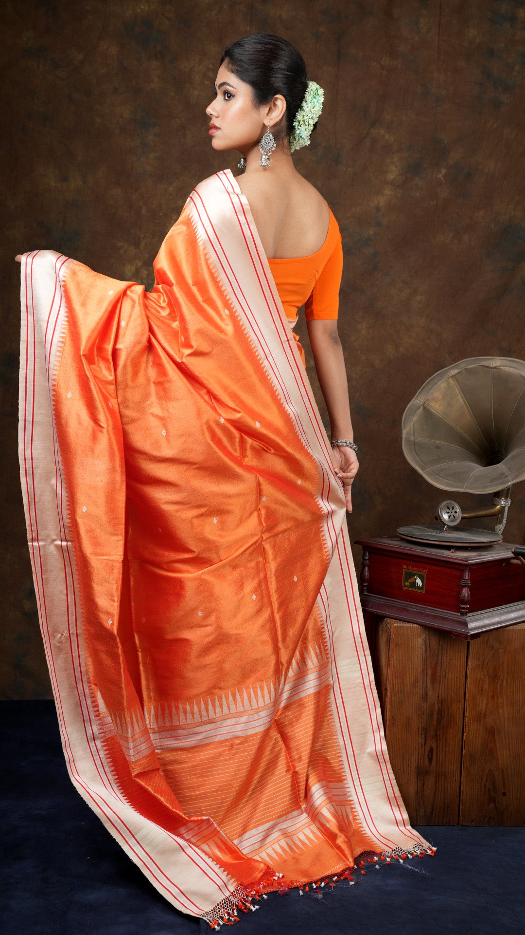 An orange silk saree