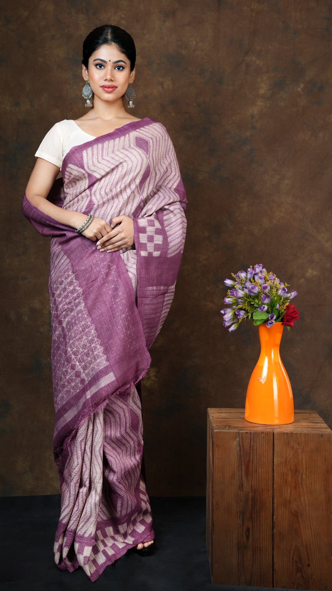 Mauve colored tassar shibori saree with traditional tie-dye pattern. Includes 0.8m running blouse piece. 5.5 meters in length.