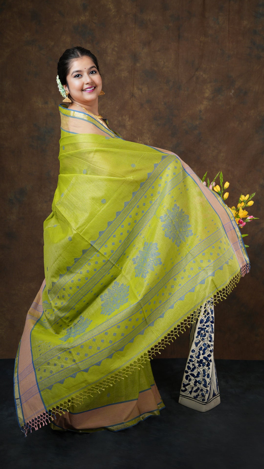 A bright green tissue saree