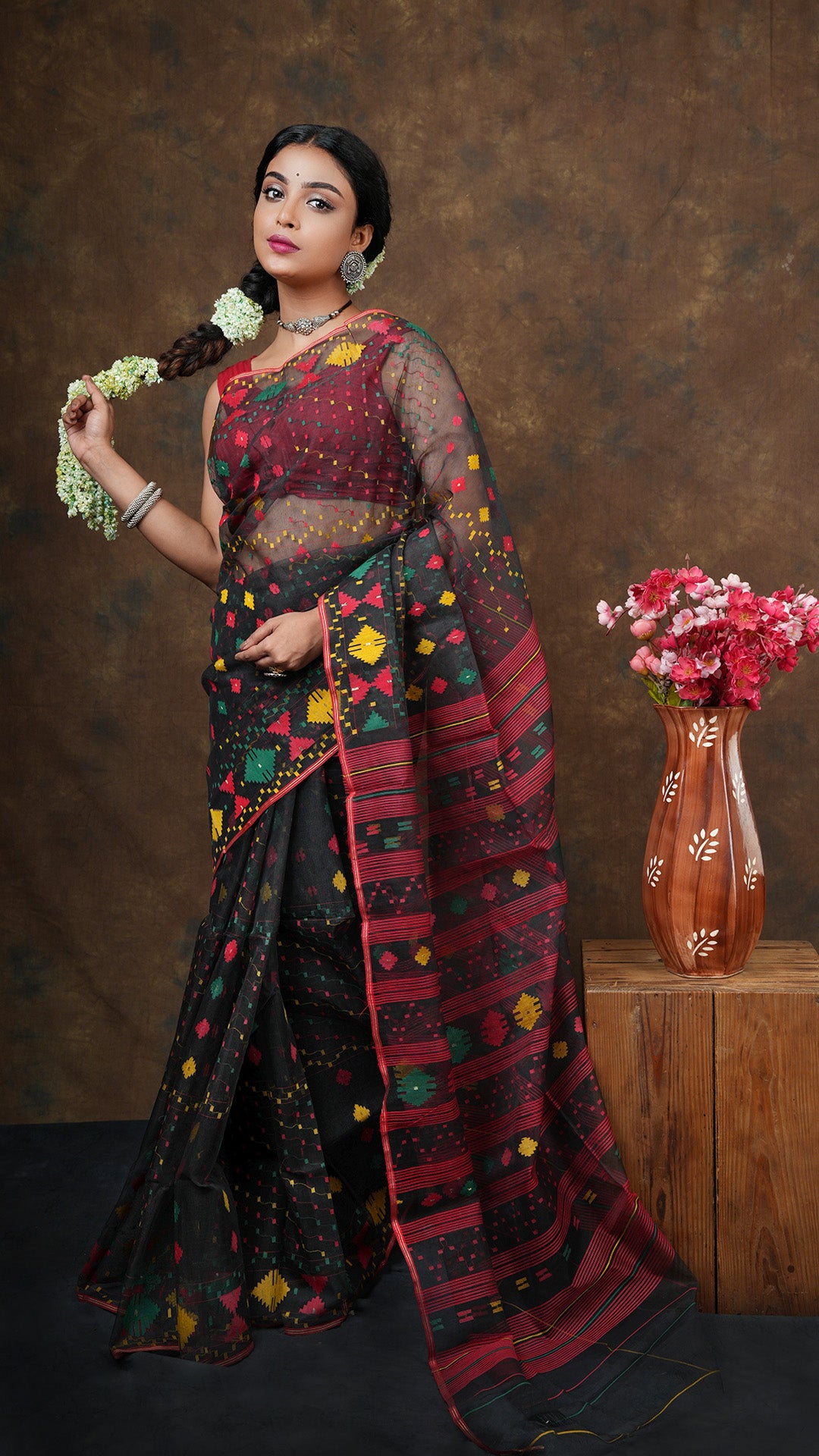  A black jamdani saree - A black Jamdani saree in muslin silk with multicolored weaves and intricate motifs. This elegant Jamdani saree, Dhakai saree, soft cotton saree is ideal for festive occasions.
