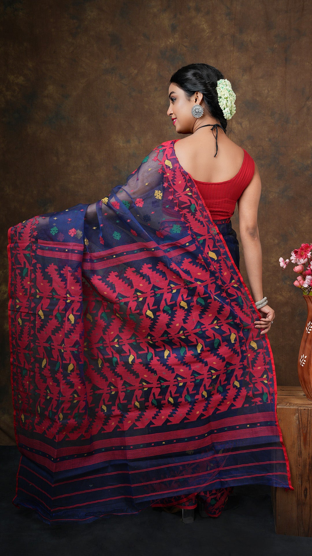 A navy blue multi coloured jamdani saree