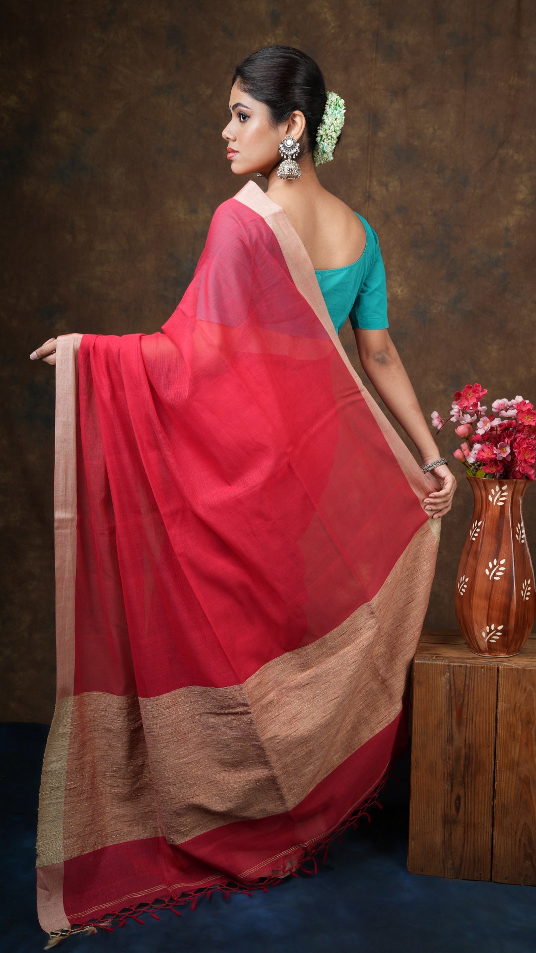 A red coloured tangail saree