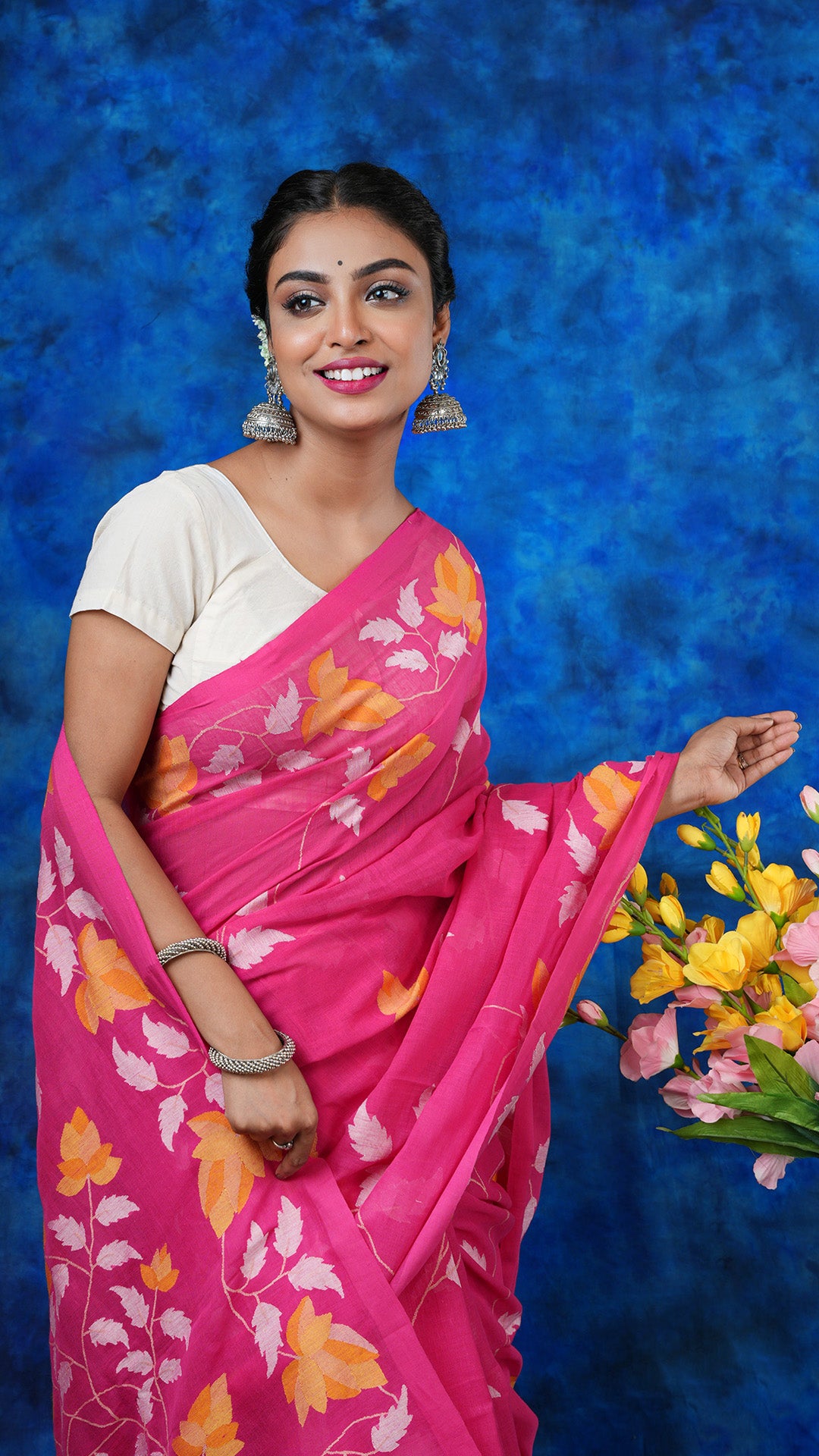 A pink coloured dhakai saree