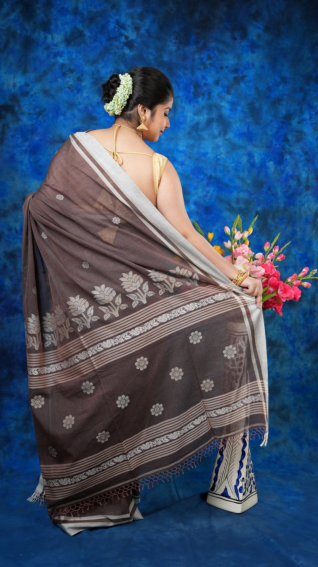 A brown colour tangail saree