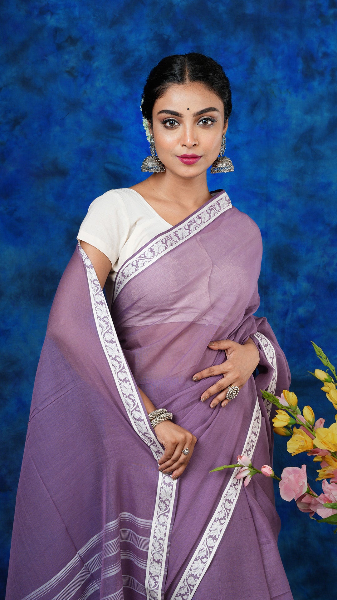 A deep mauve saree with small border