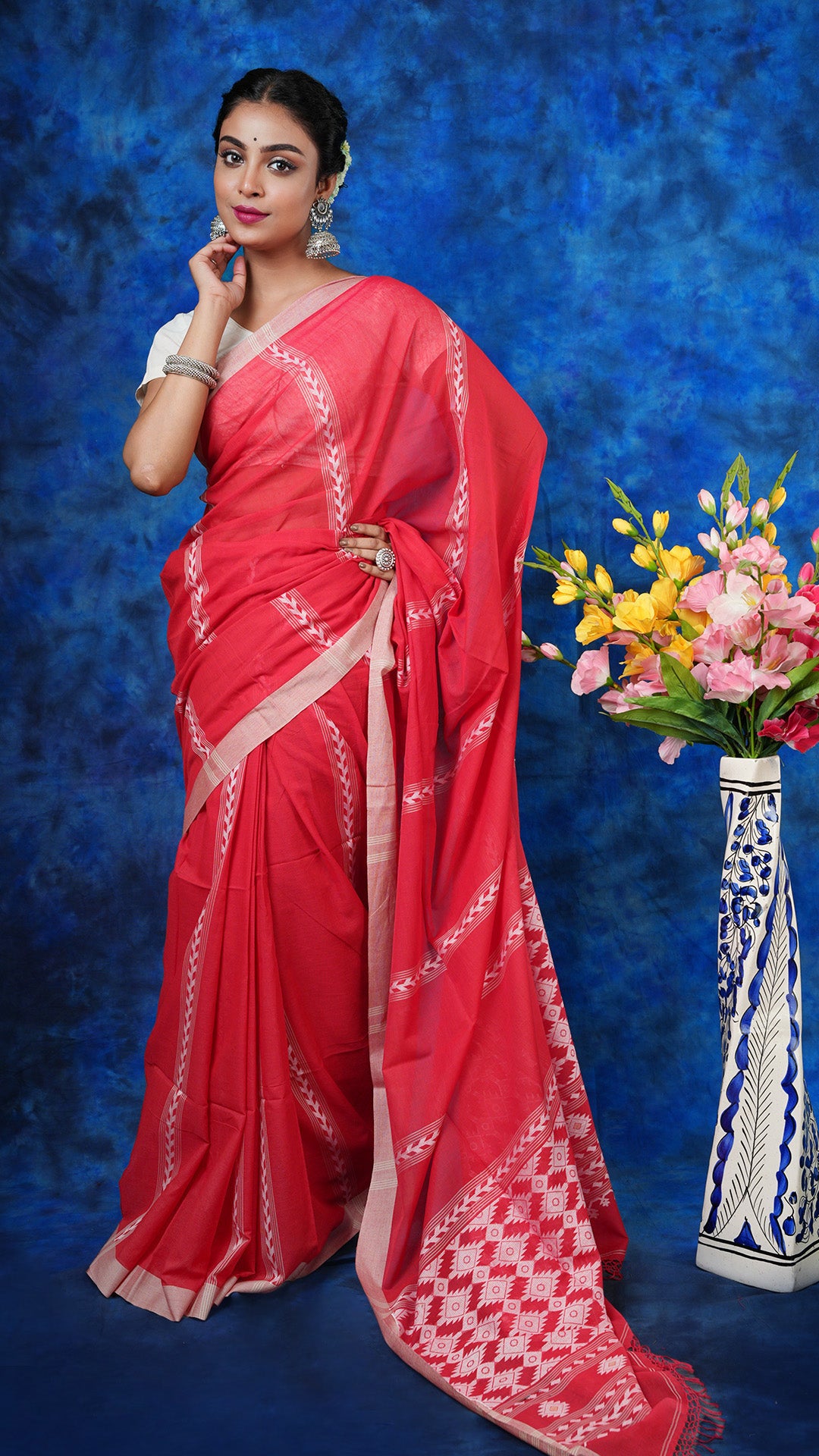A red soft cotton saree - A red soft cotton saree with beige border, white woven vertical stripes, and matching pallu. This ethnic handloom saree is perfect for everyday grace.