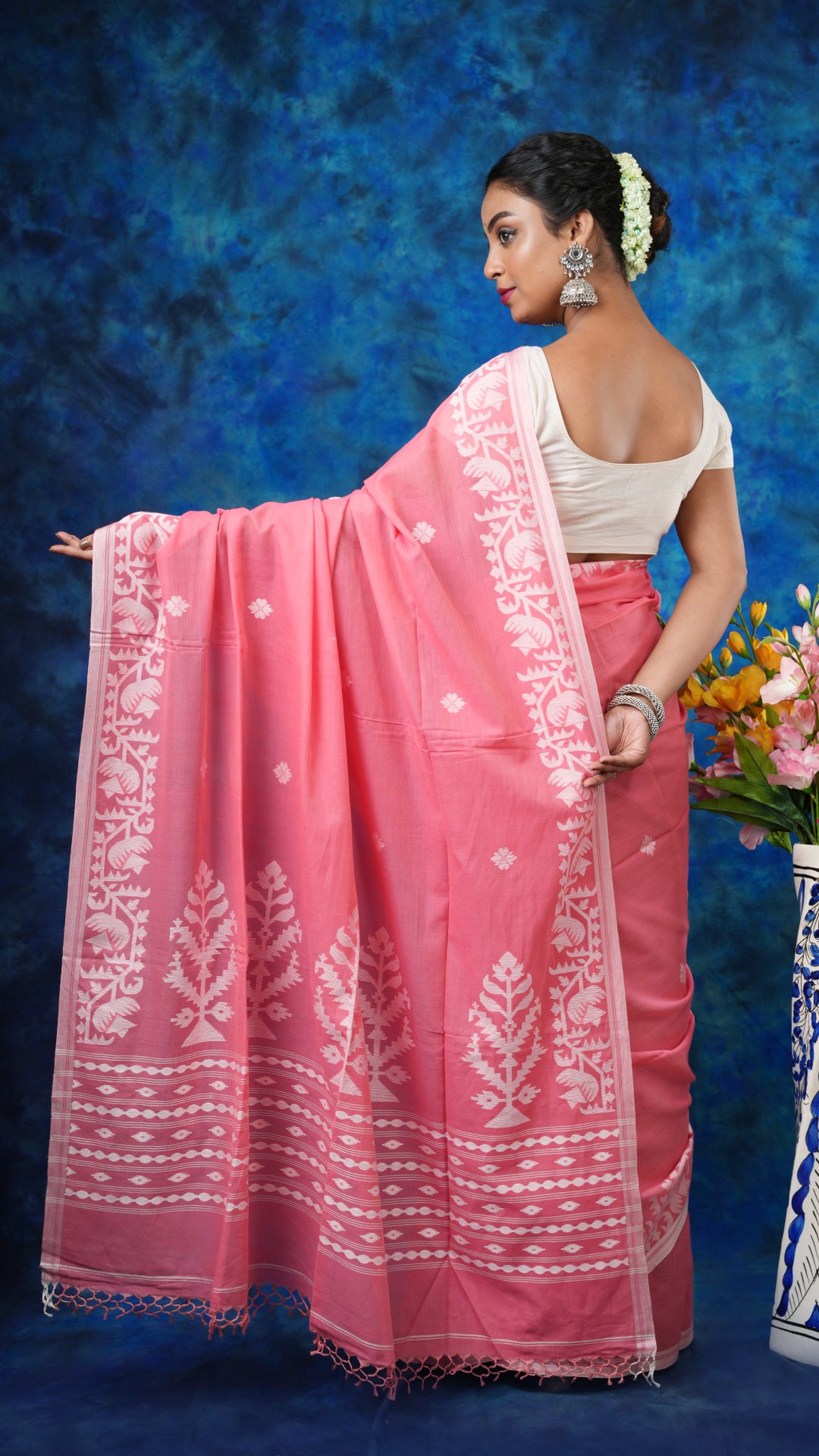 A peach coloured saree