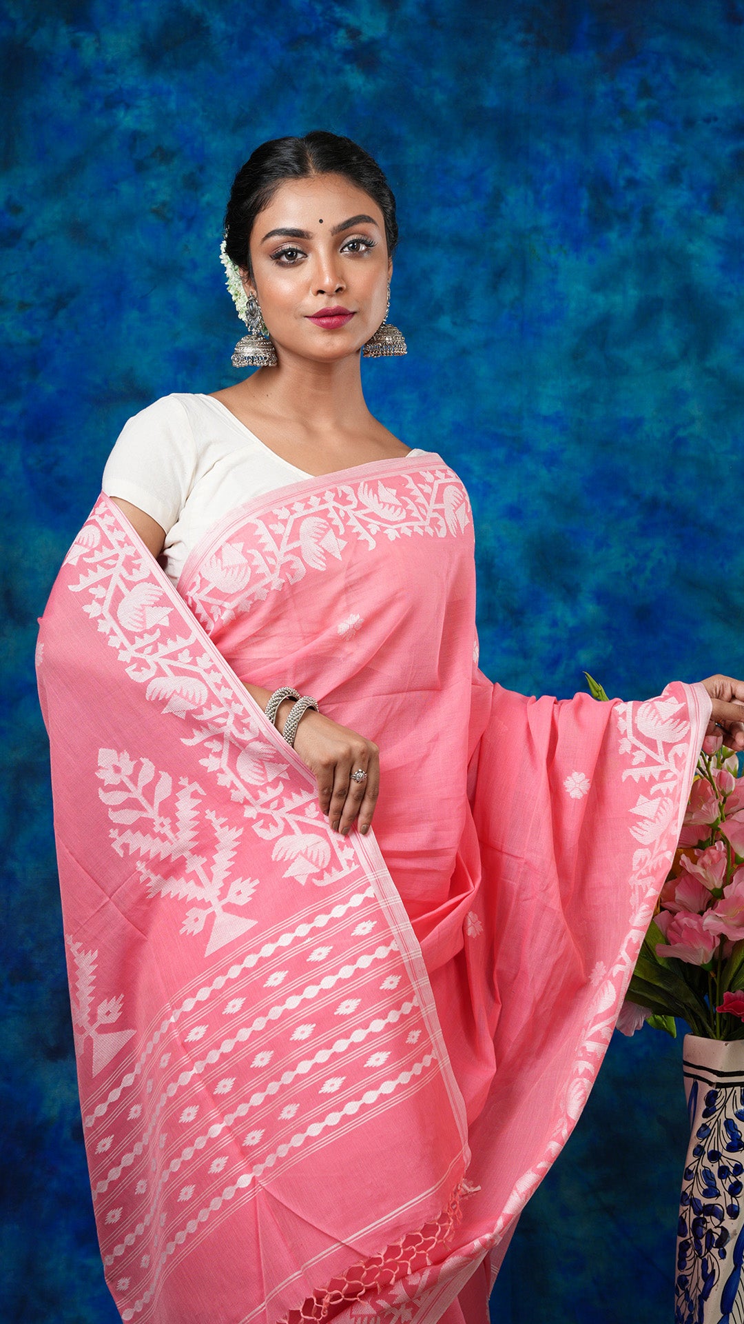A peach coloured saree