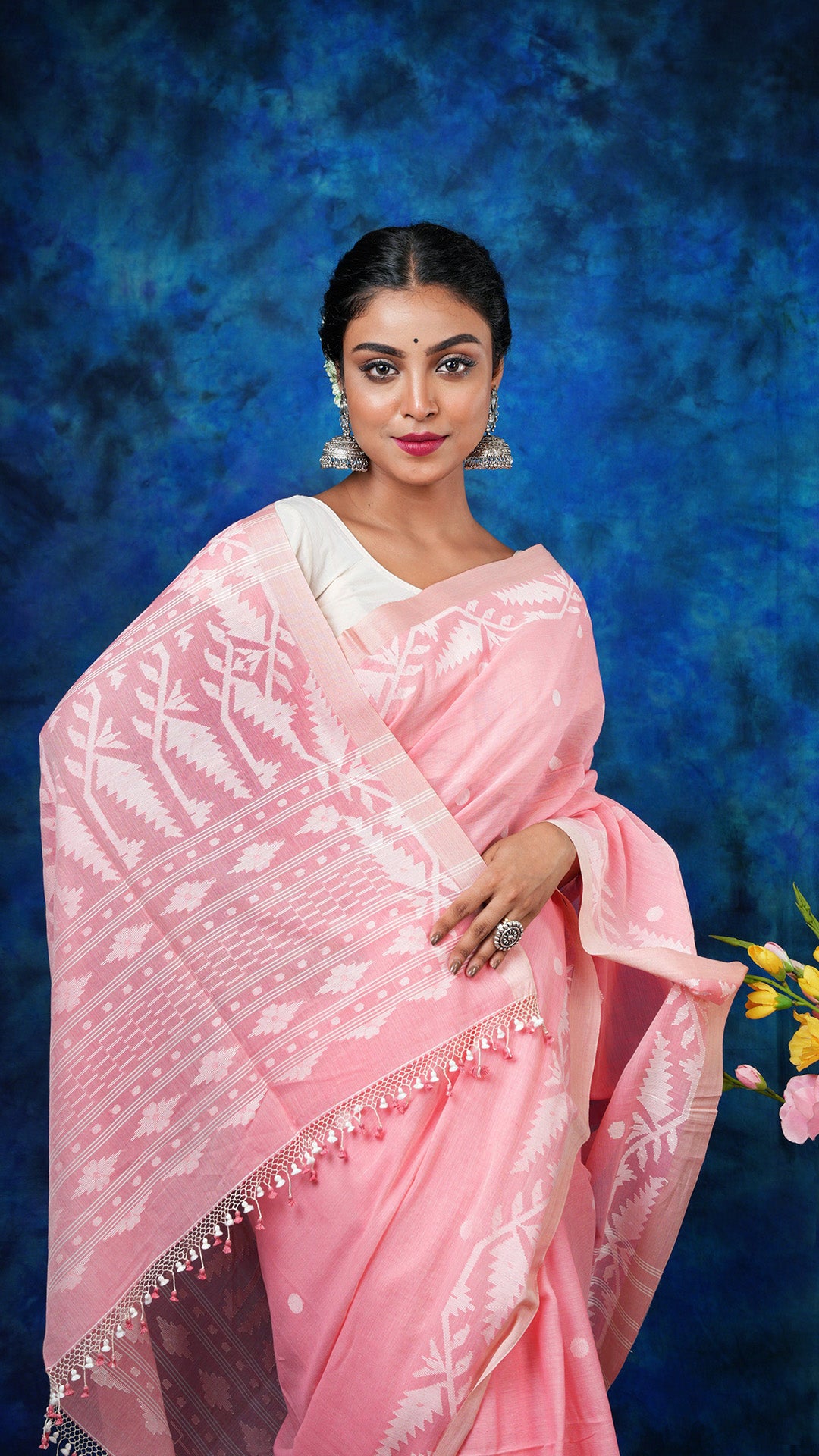 A light peach colour dhakai saree