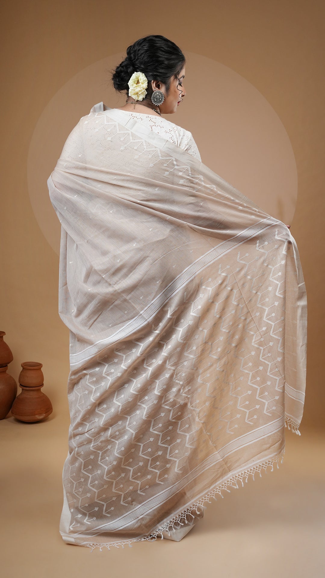A fawn colour dhakai saree