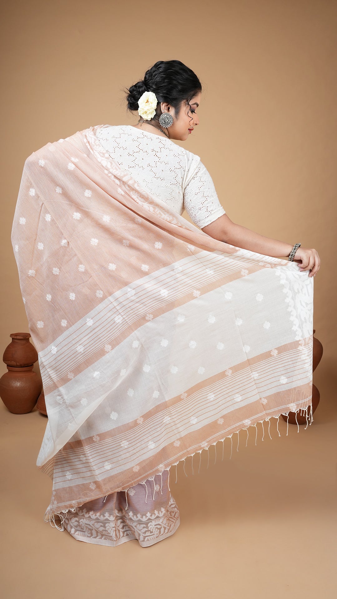 A beize coloured machine made saree