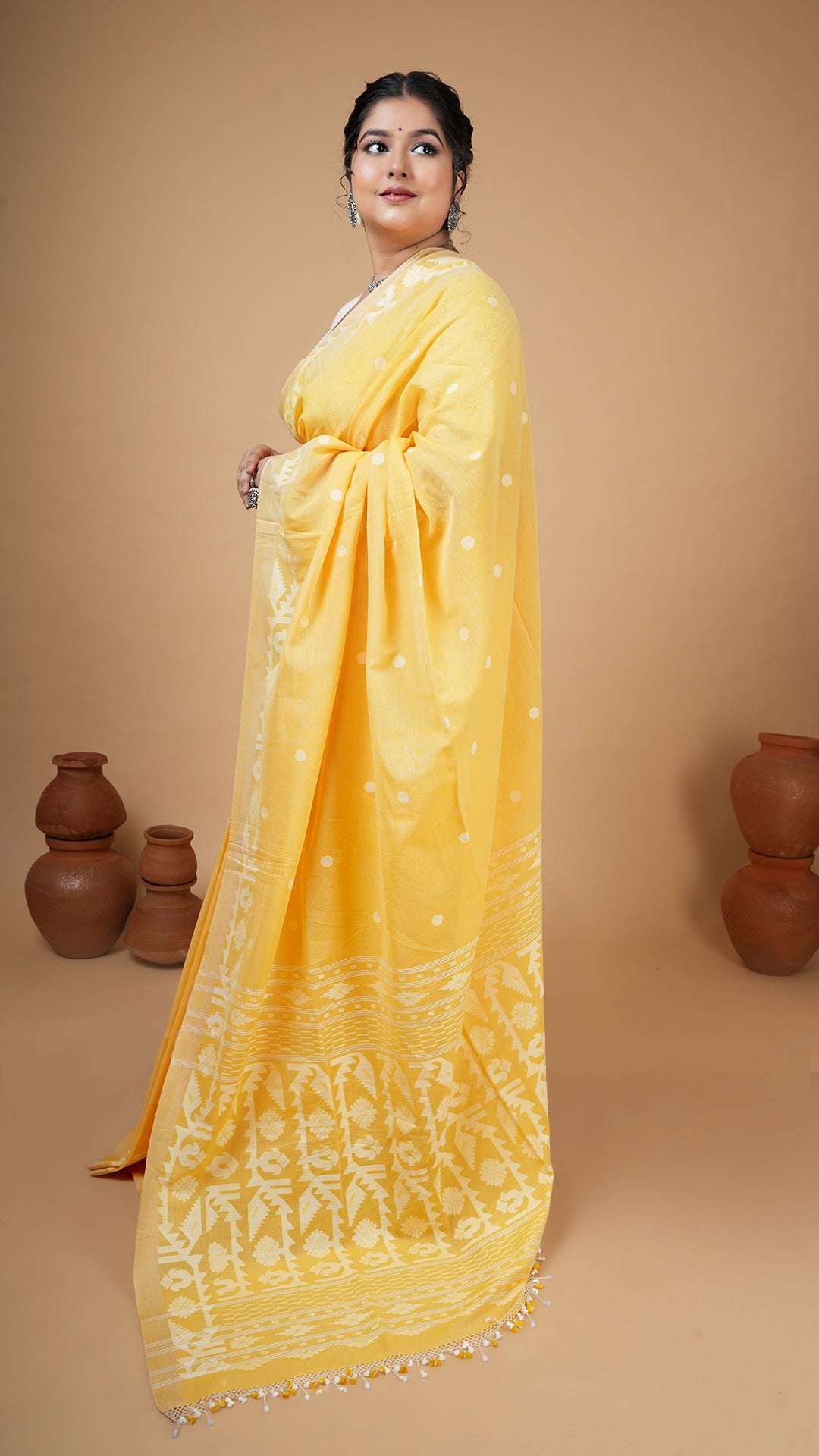 A dhakai saree in yellow colour