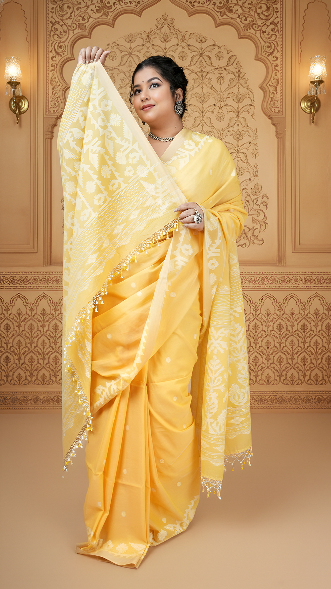 Yellow soft cotton dhakai saree with white woven butis, pallu, and border. Ideal saree for haldi, puja and festive celebrations.