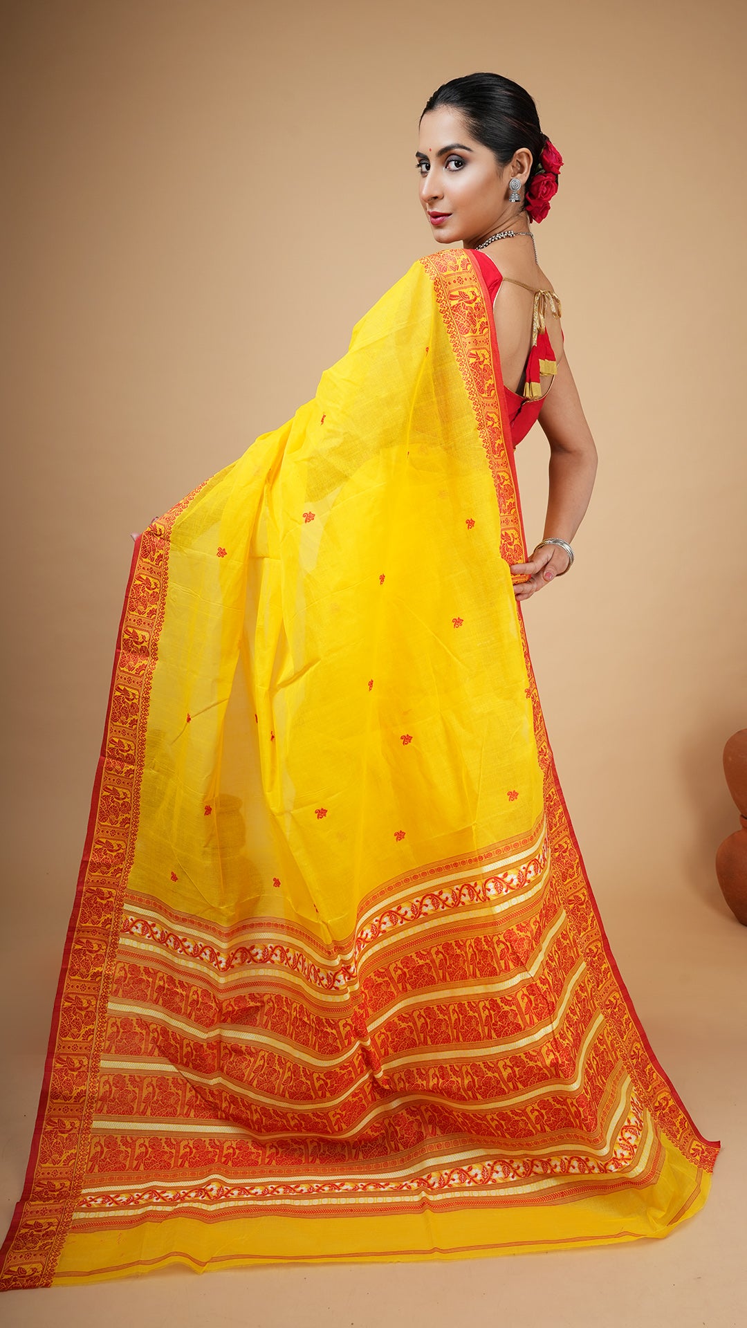 A yellow and red baluchari saree