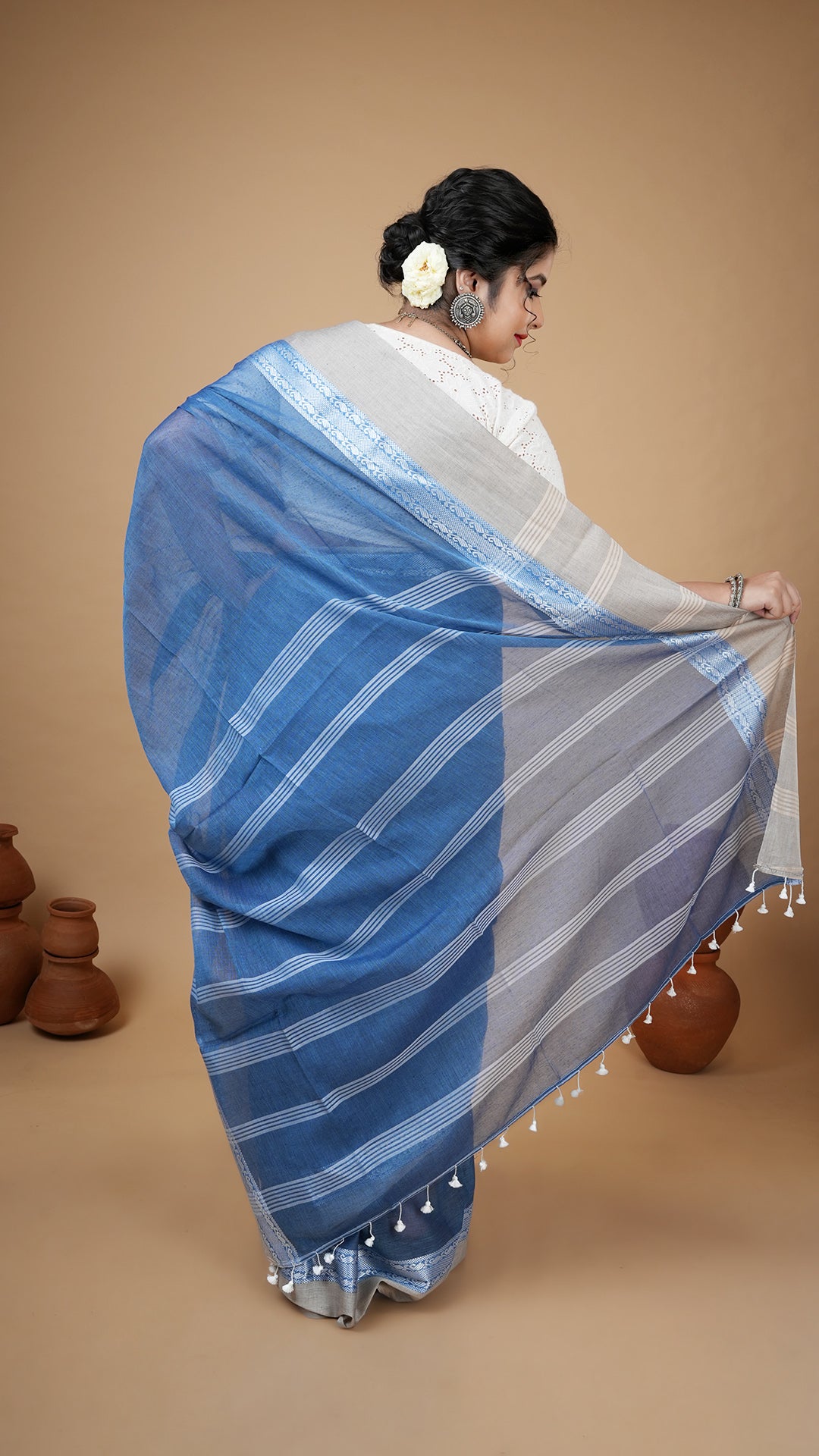 A short blue tangail saree