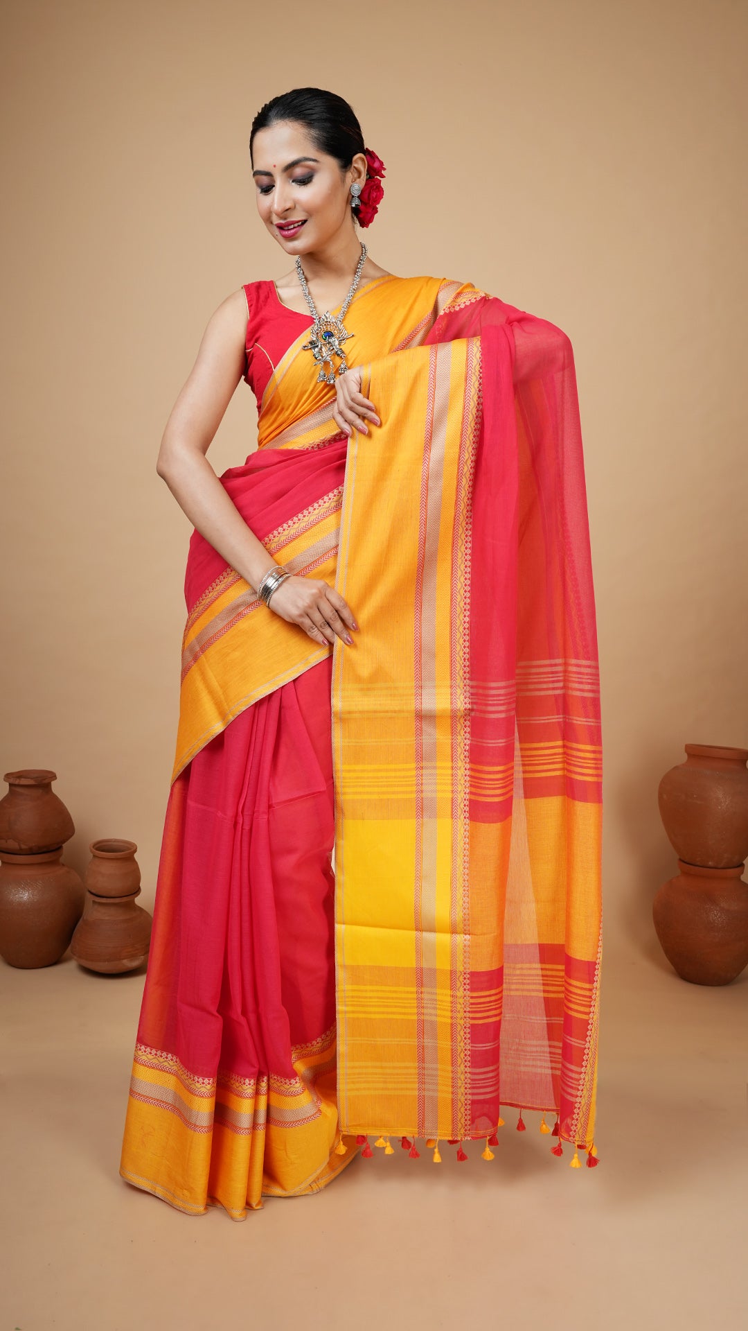 Red soft cotton tangail saree with flat yellow and beige border, no butis. Perfect for regular ethnic use or puja.