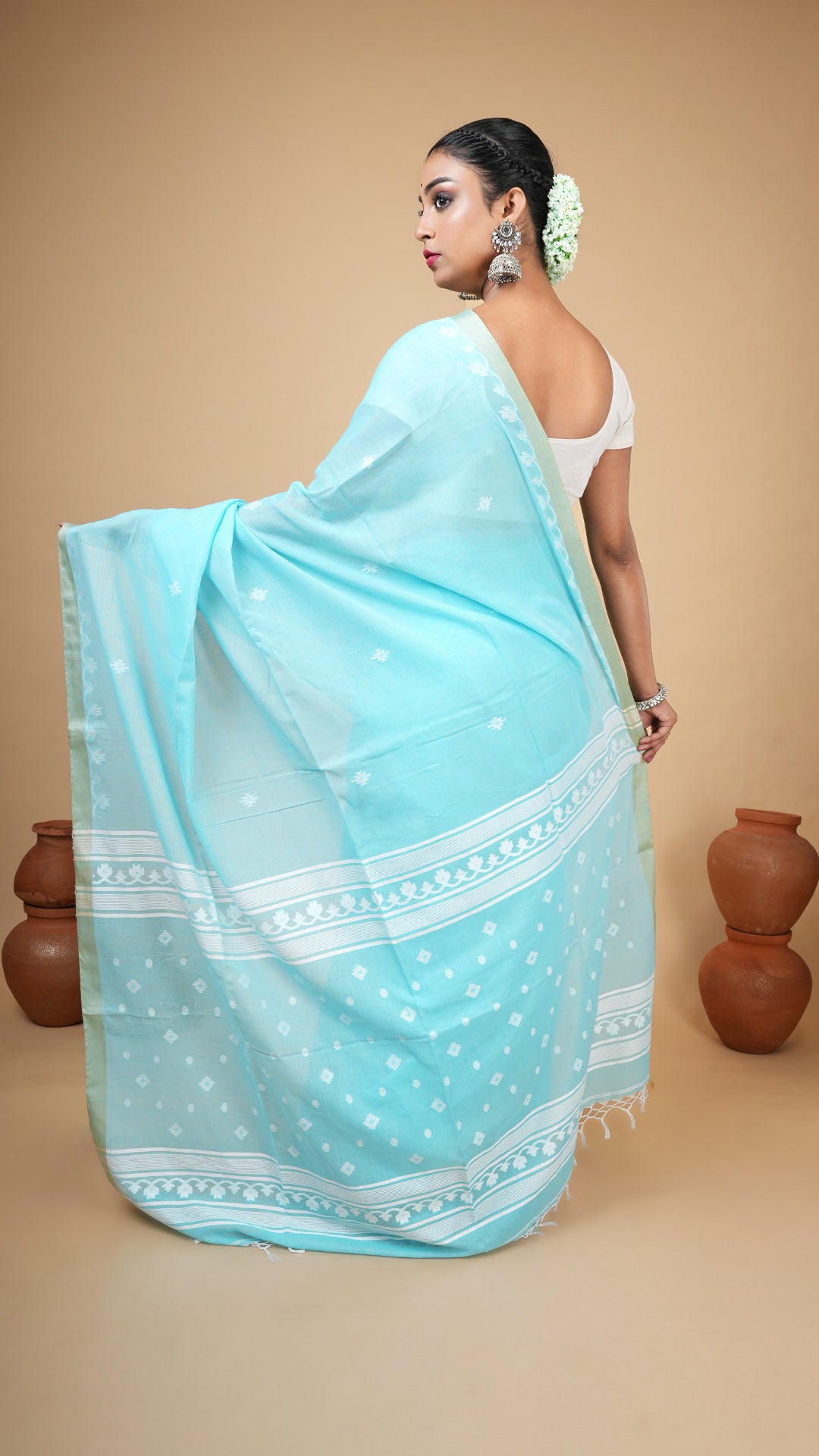A firozi bluetangail saree