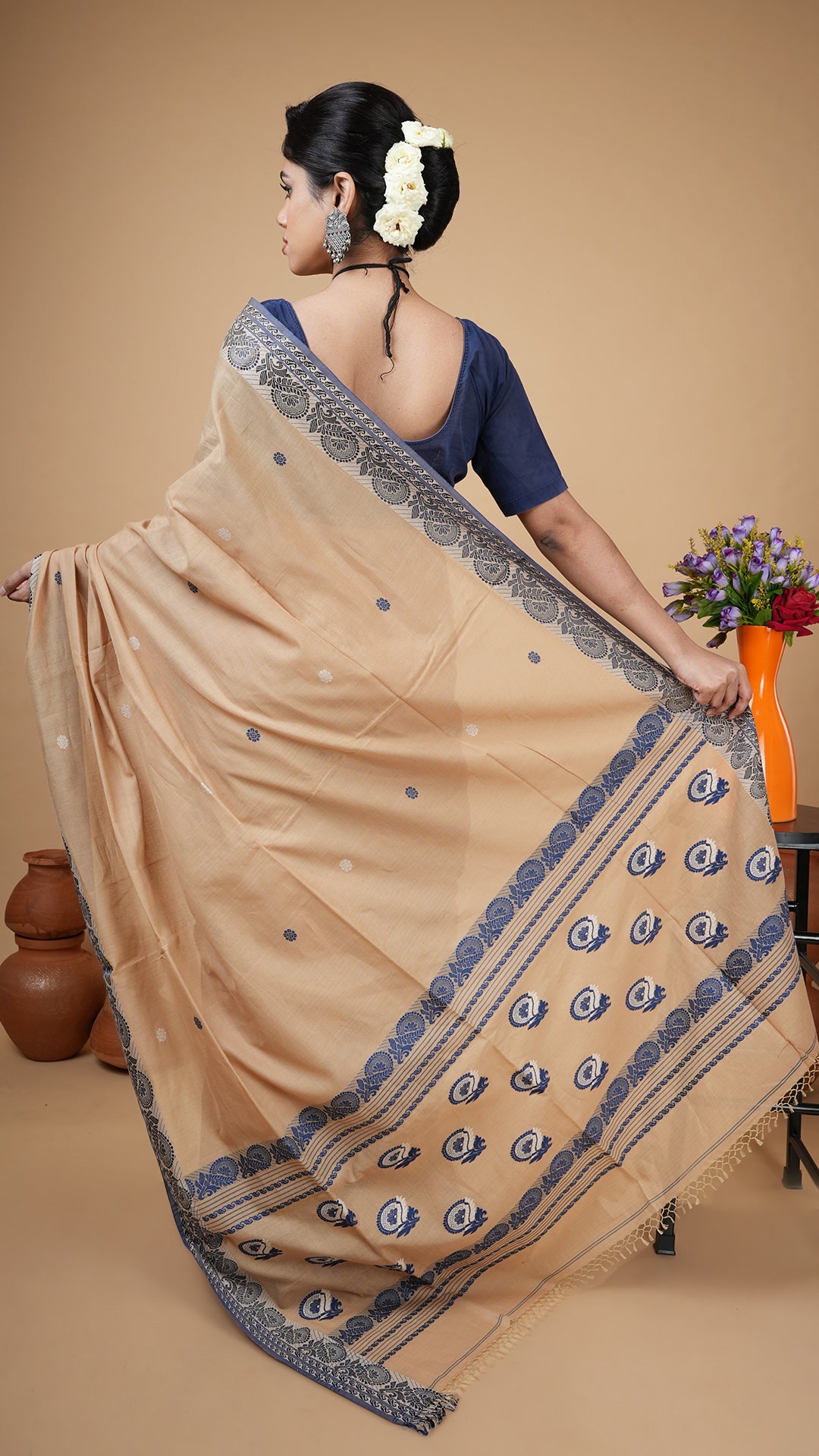 A beize and blue tangail saree