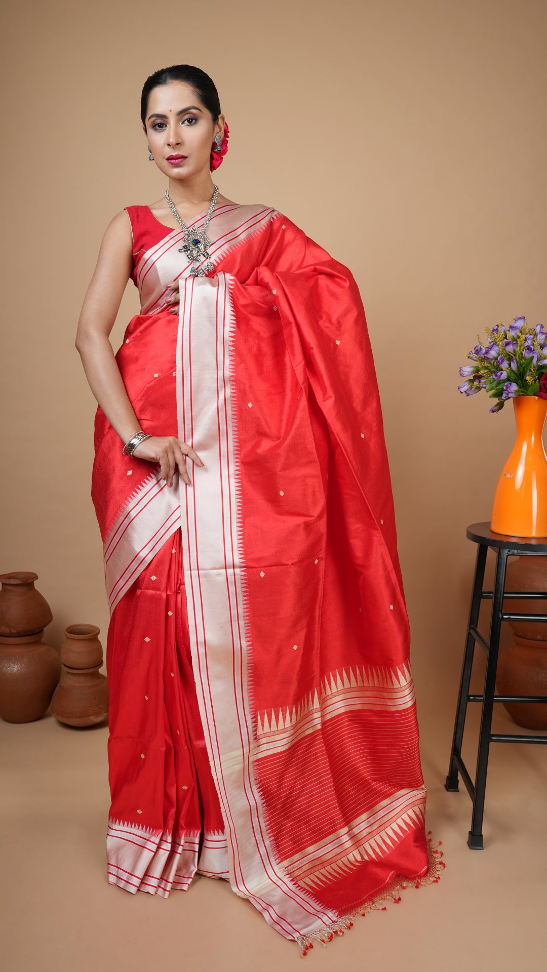 Red silk tangail saree with off-white border, yellow woven butis and pallu. Grand festive and wedding saree.