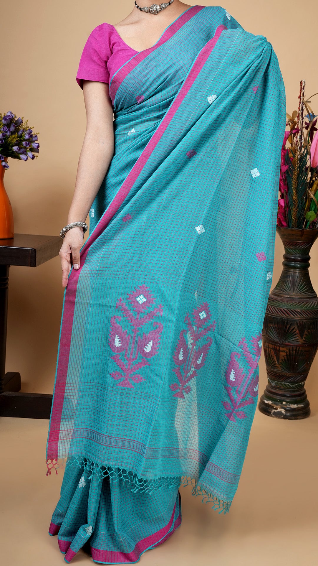 A sea green check saree